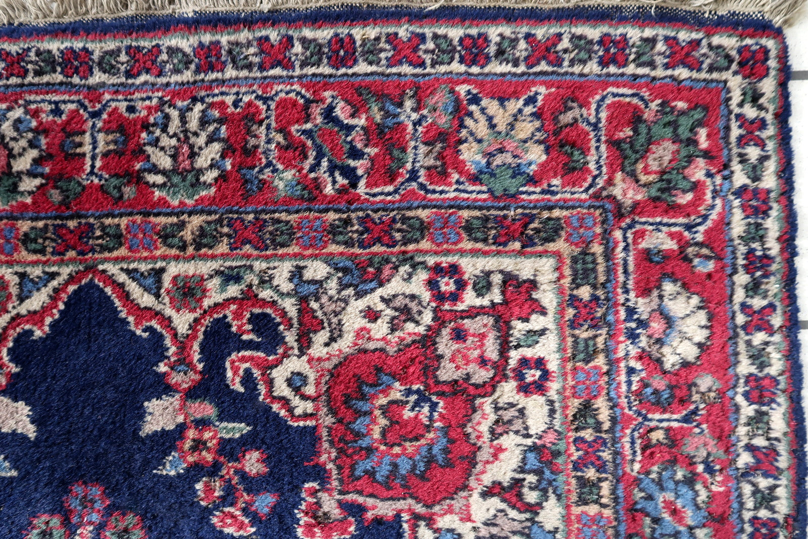Handmade antique Persian Kerman rug in bright blue and red shades. The rug is from the beginnig of 20th century in good condition.