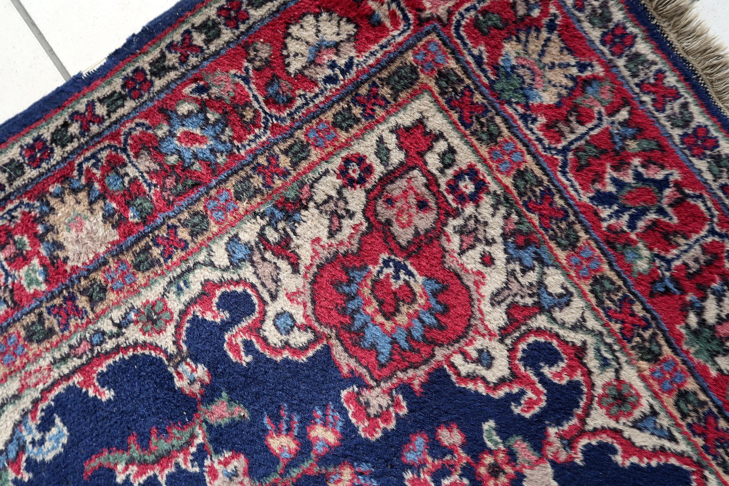 Handmade antique Persian Kerman rug in bright blue and red shades. The rug is from the beginnig of 20th century in good condition.