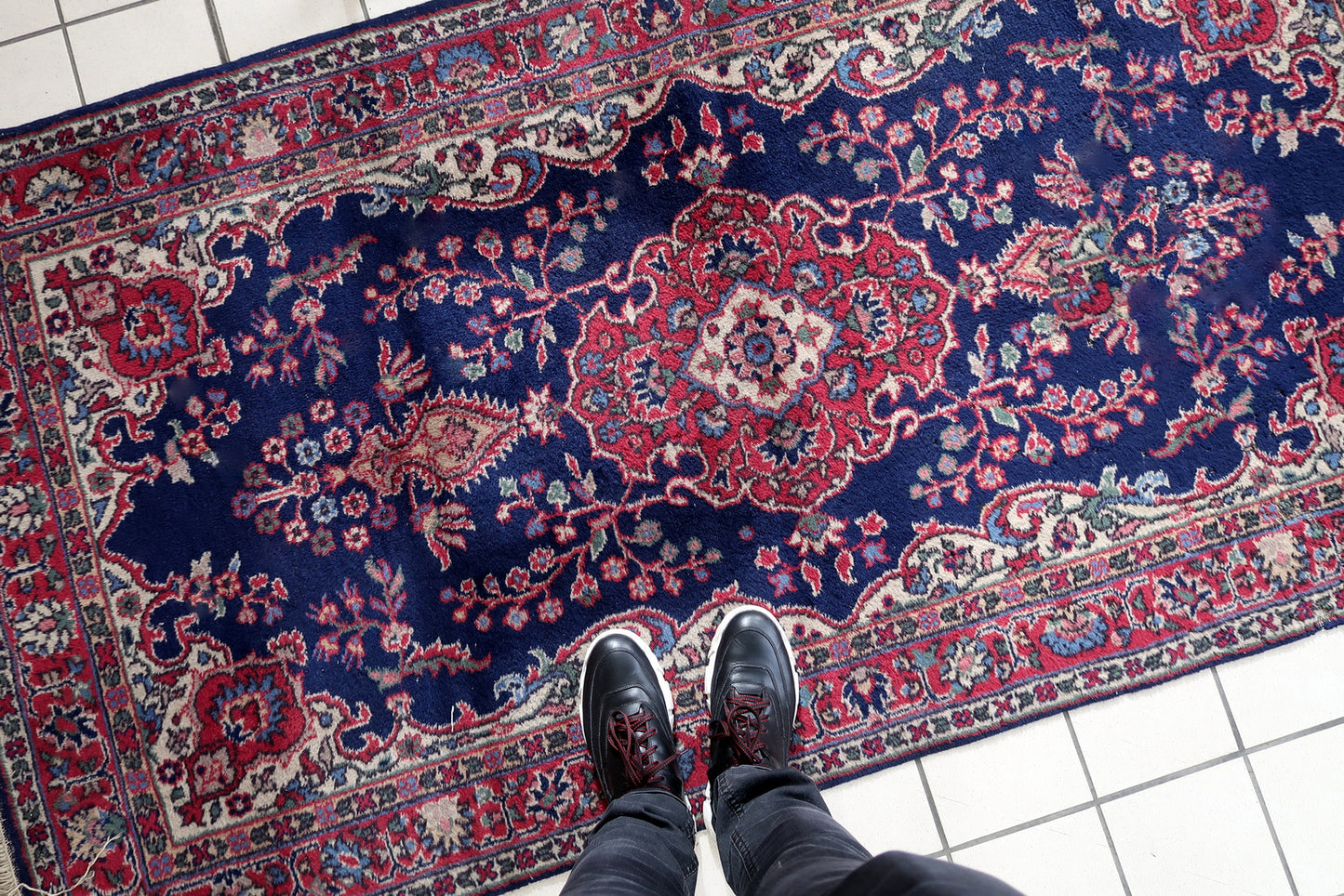 Handmade antique Persian Kerman rug in bright blue and red shades. The rug is from the beginnig of 20th century in good condition.