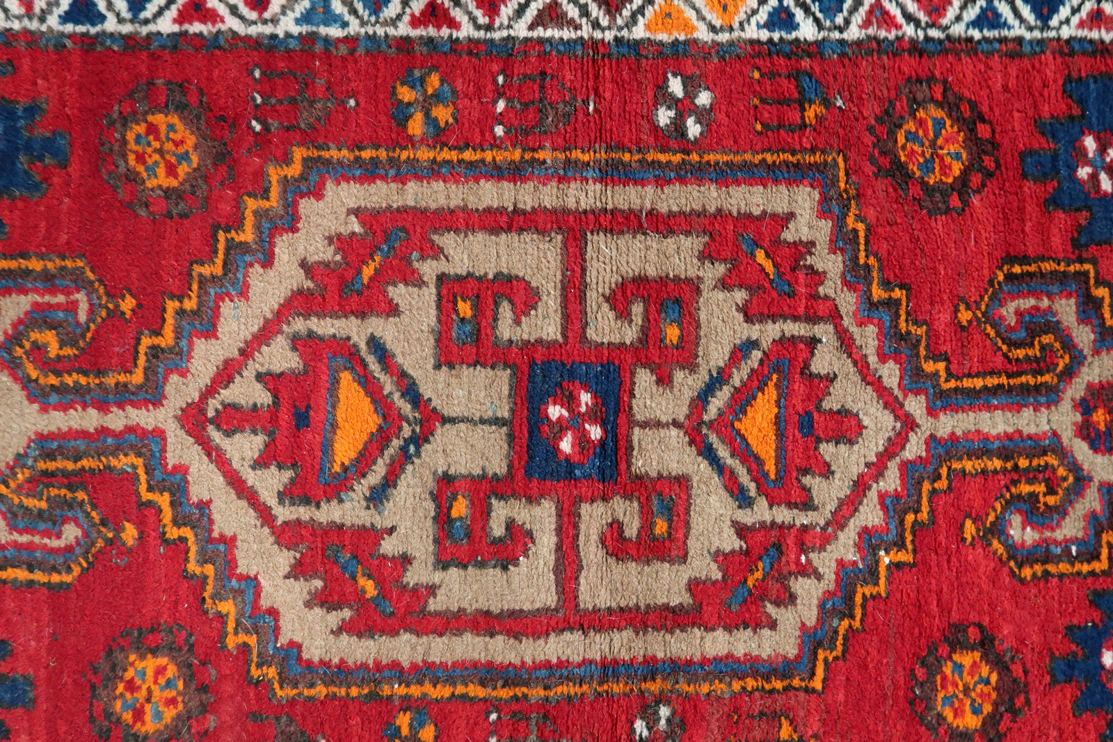 Handmade vintage Persian Hamadan rug in bright red color with large medallion. The rug is from the end of 20th century in original condition, it has some low pile.