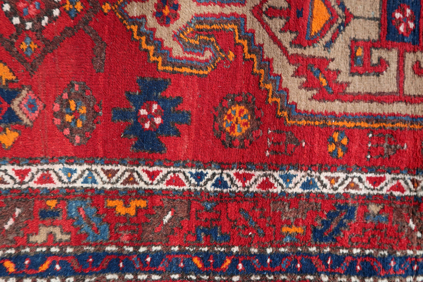 Handmade vintage Persian Hamadan rug in bright red color with large medallion. The rug is from the end of 20th century in original condition, it has some low pile.