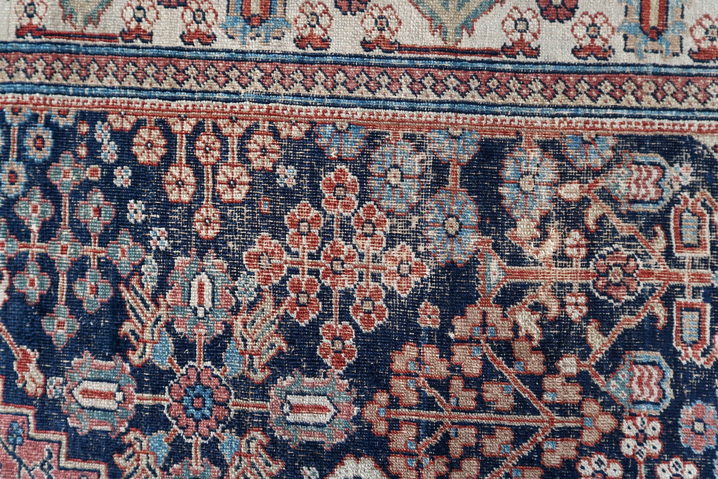 Handmade antique Persian Jozan rug in traditional design and night blue color. The rug is from the beginning of 20th century in distressed condition. On the sign it says 1335 year by Islamic calendar, it is 1915th year.