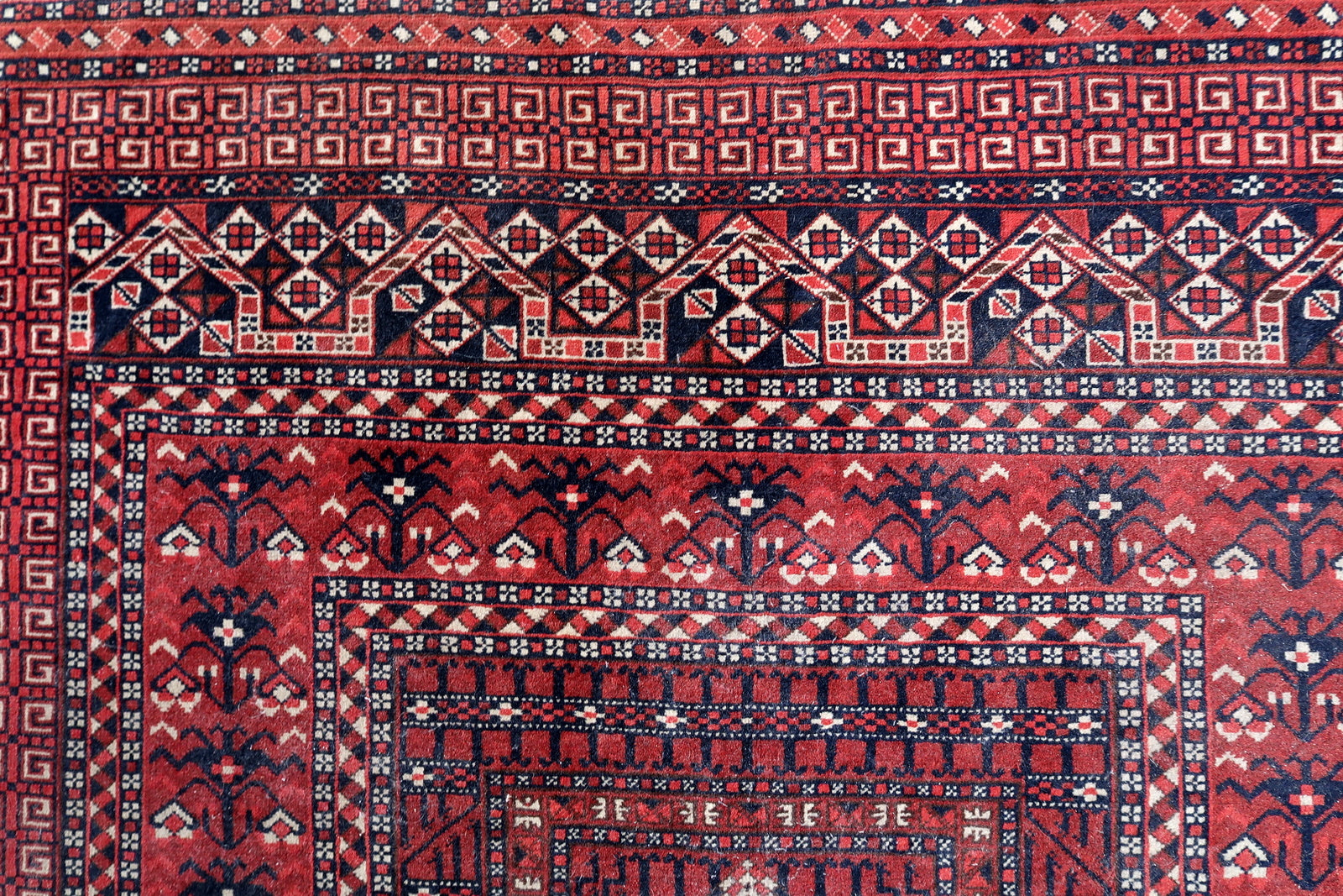 Handmade vintage Turkmen Hachli rug in traditional design and deep shades. The rug is from the middle of 20th century in original good condition.