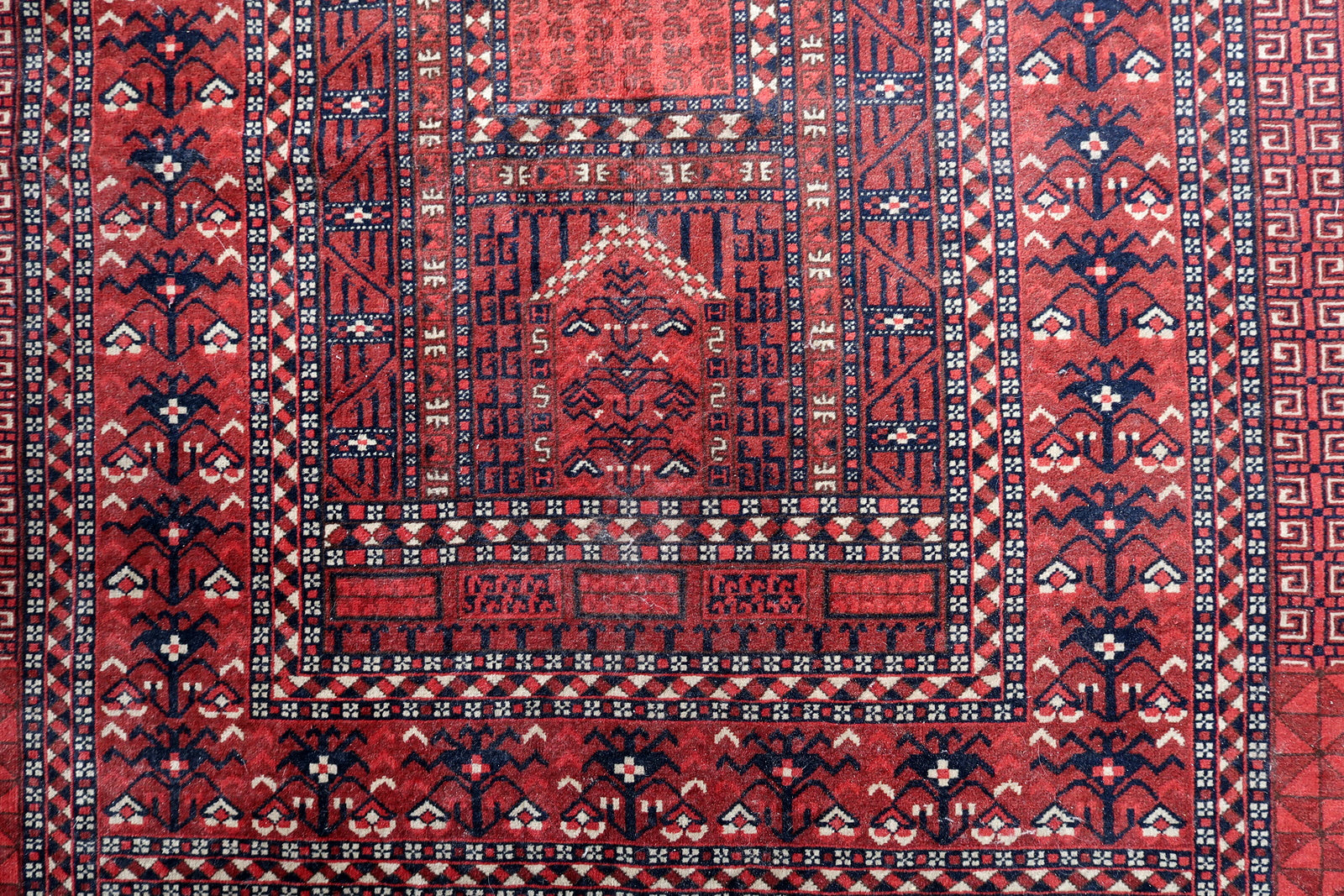 Handmade vintage Turkmen Hachli rug in traditional design and deep shades. The rug is from the middle of 20th century in original good condition.