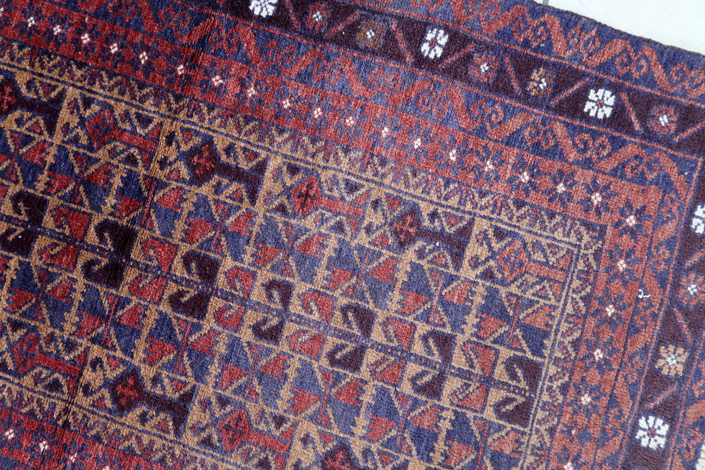 Handmade vintage Afghan Baluch rug in prayer design. The rug is from the end of 20th century in original good condition.