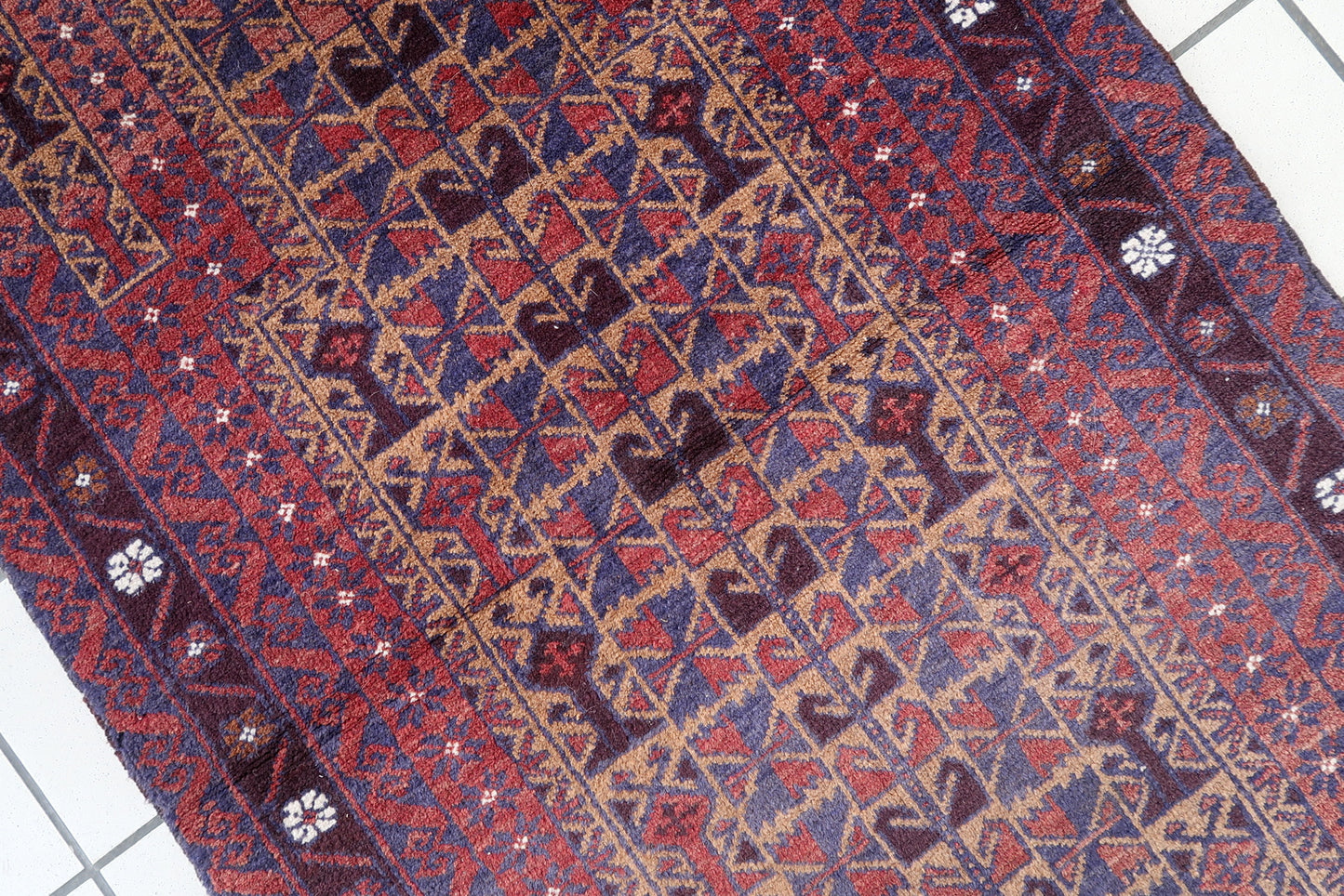 Handmade vintage Afghan Baluch rug in prayer design. The rug is from the end of 20th century in original good condition.