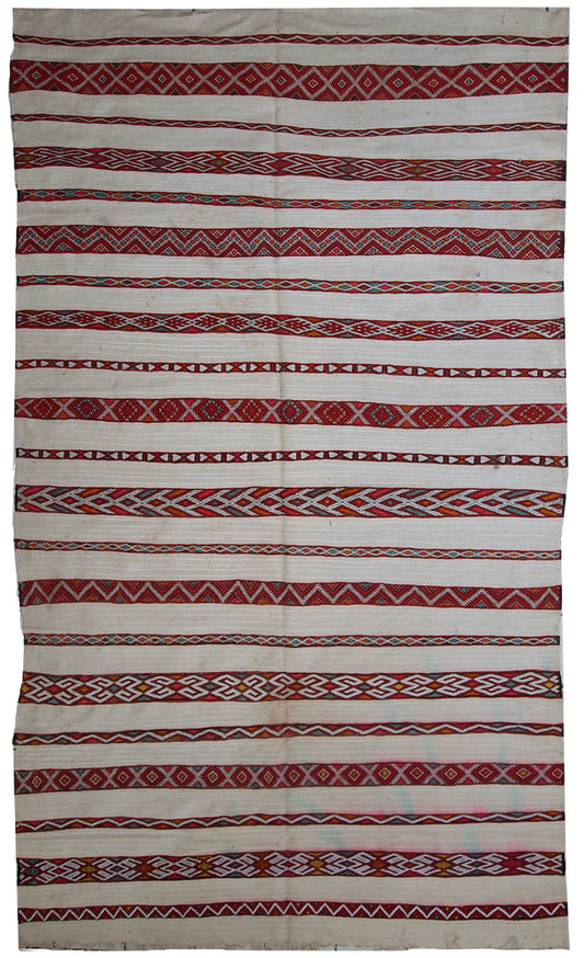 Main view of a vintage Moroccan kilim showcasing beige shade with colorful stripes in red, beige, green, and orange.