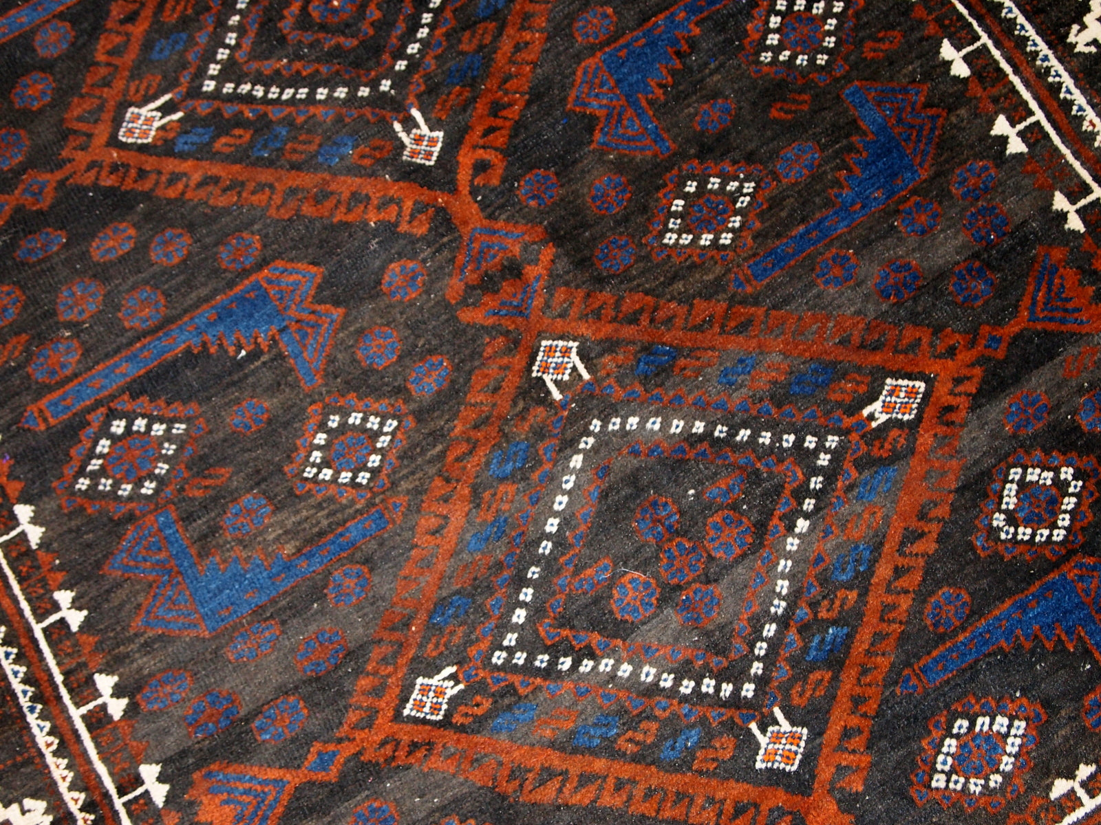 A closer look at the craftsmanship and detailed patterns on the rug.