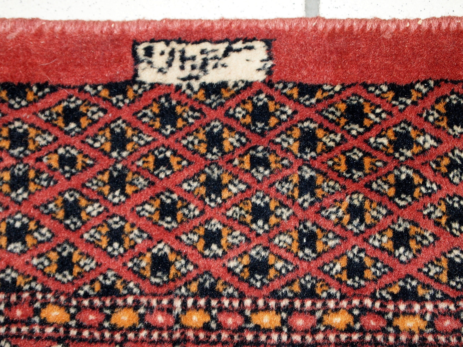 Detailed Shot of Tribal Figures on the Rug
