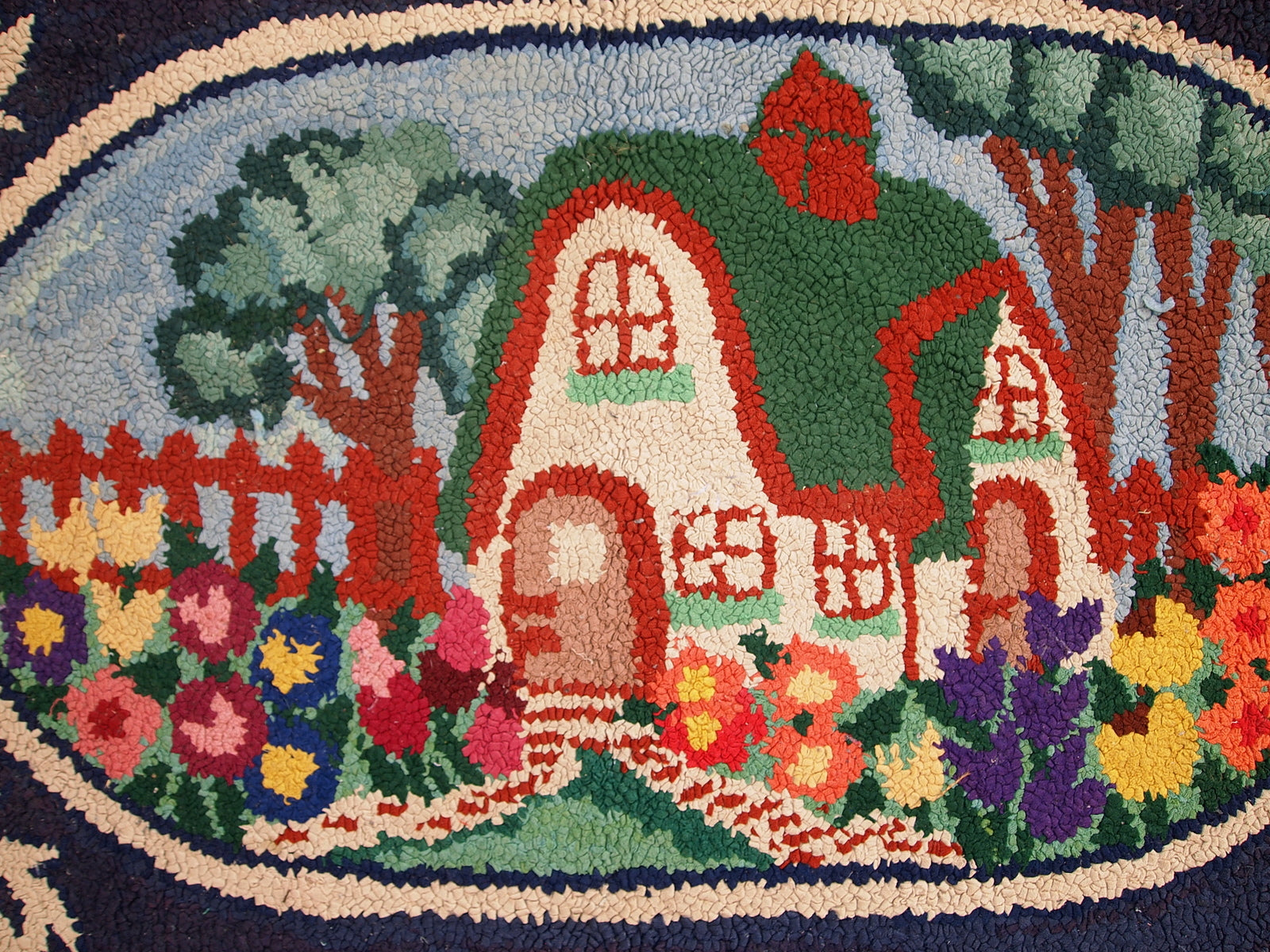 Detailed view of the beige elements in the rug's pictorial design