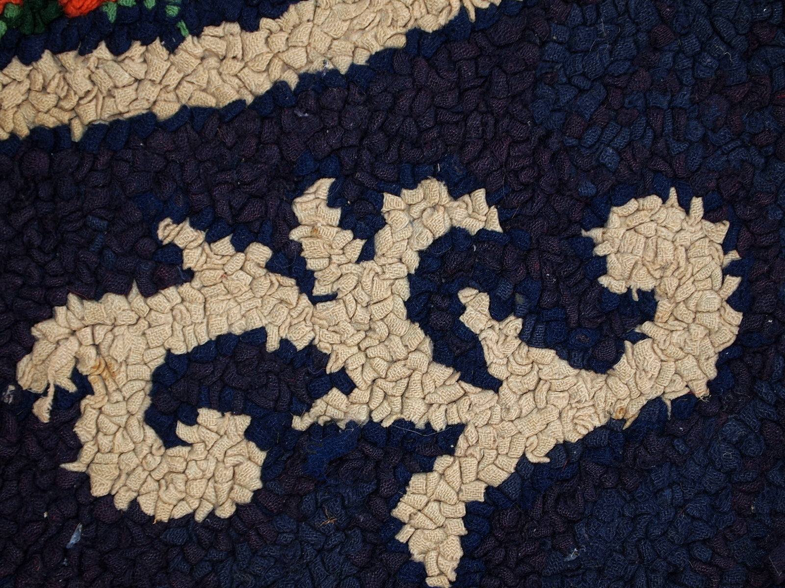 Detailed view of the lush greenery depicted in the rug.