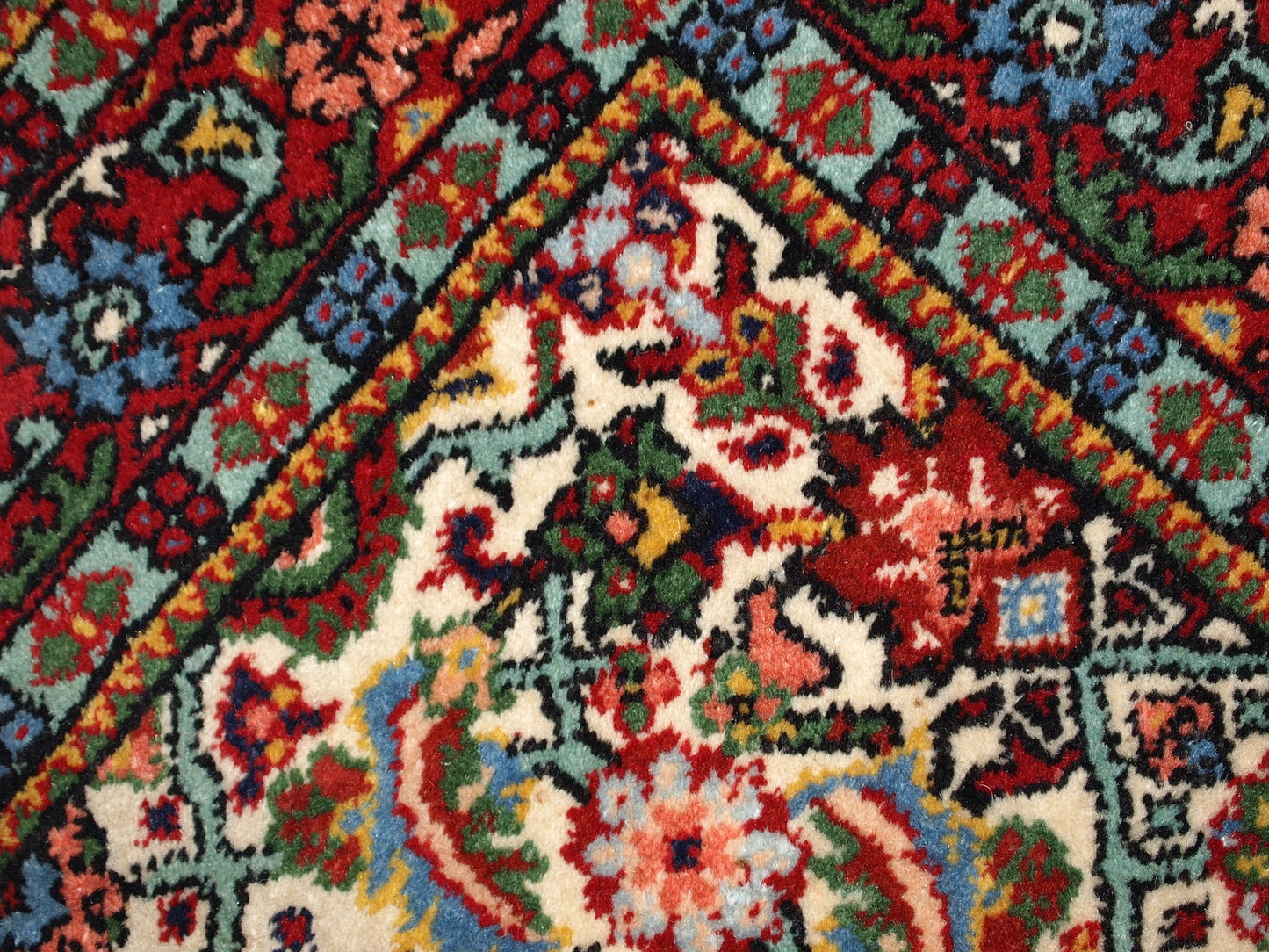 Artistic details of antique Indian Mahal rug