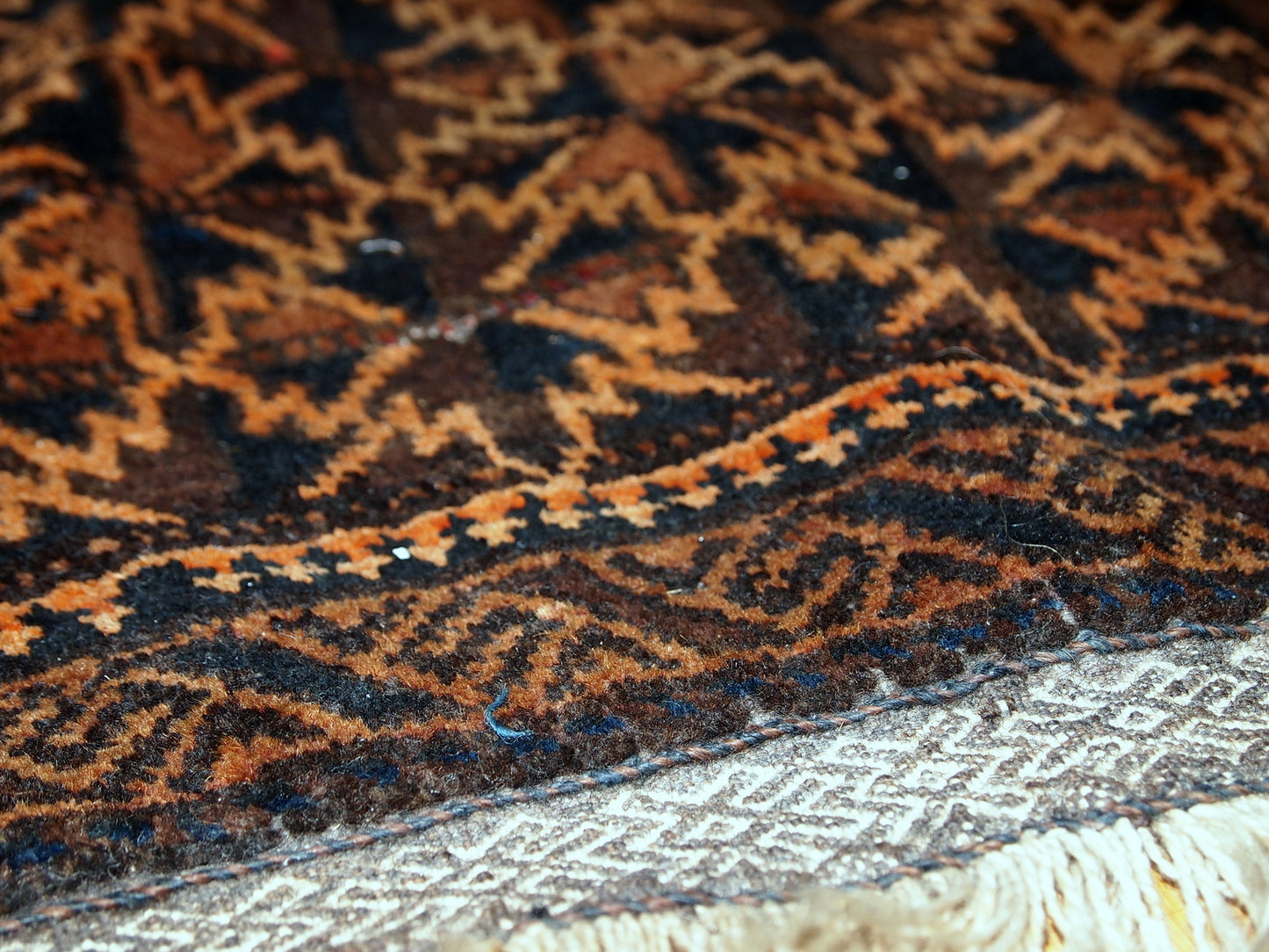 Antique hand made Afghan Baluch bag face in original condition, has some age wear and a little bit crooked. The main colors on this rug is orange, also has some different shades of brown. 