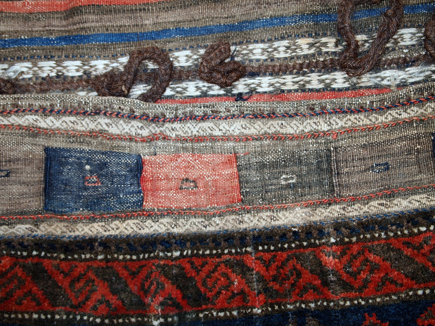 Antique hand made Afghan Baluch salt bag in original good. The rug is from the end of 19th century in night blue, olive green and red shades.