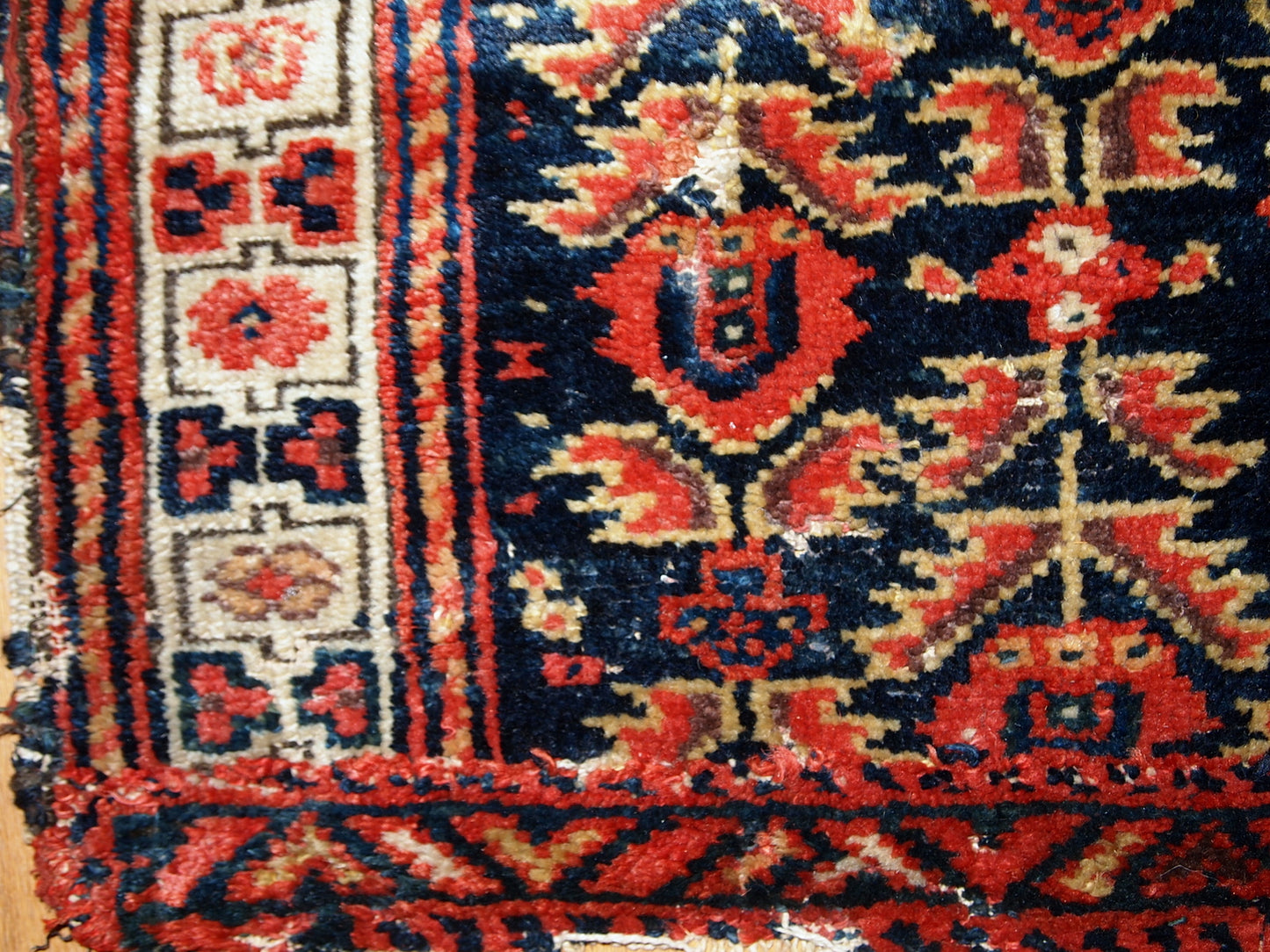 Hand made antique Malayer bag face in original condition with some age wear. The rug made has traditional tribal design in navy blue, white and red shades. 