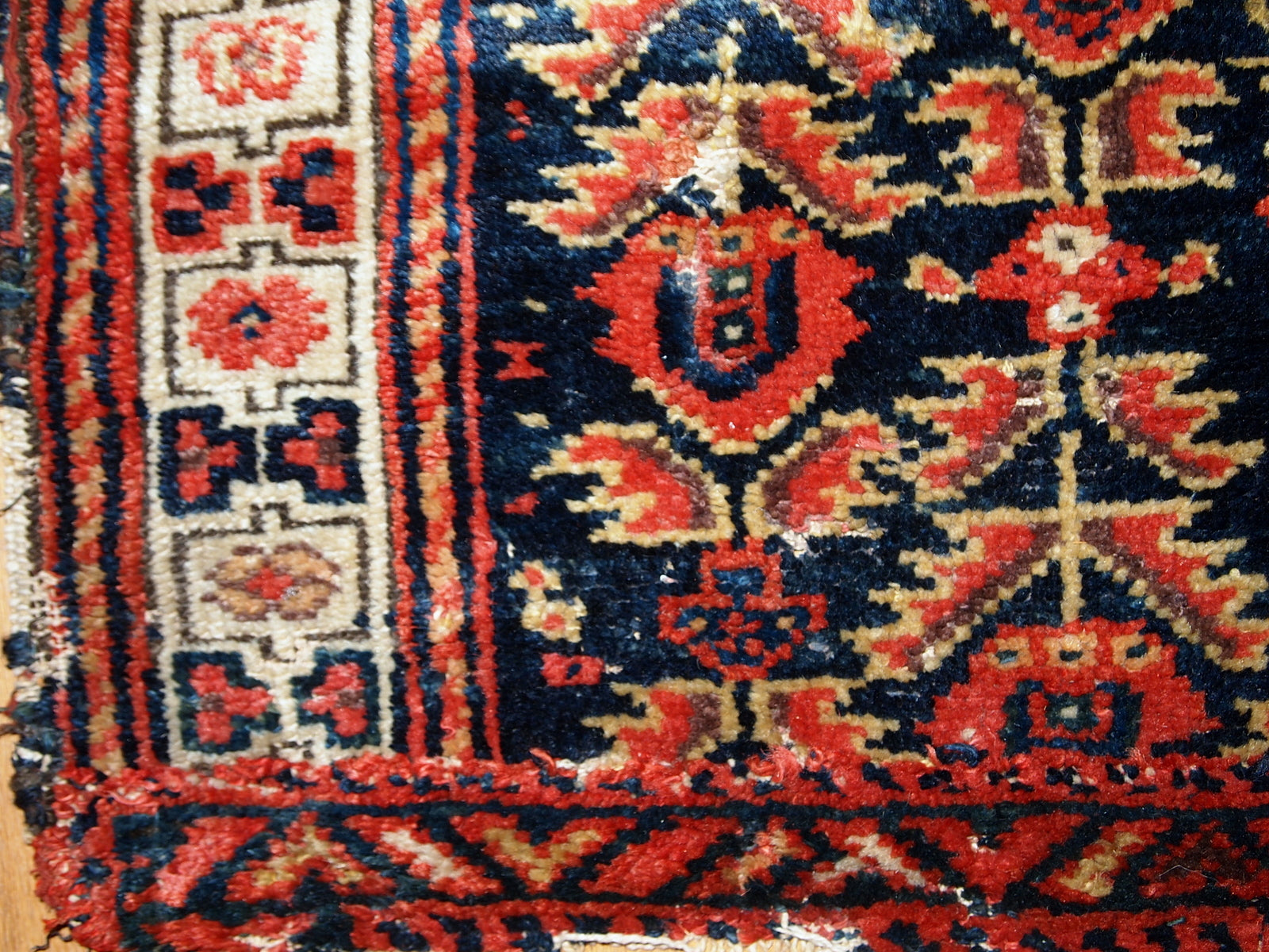 Hand made antique Malayer bag face in original condition with some age wear. The rug made has traditional tribal design in navy blue, white and red shades. 