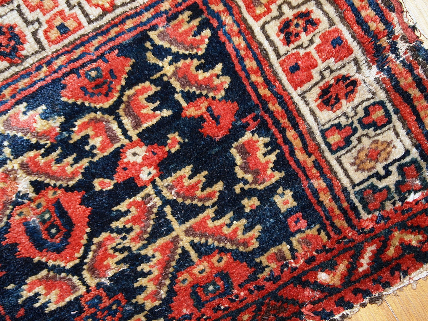Hand made antique Malayer bag face in original condition with some age wear. The rug made has traditional tribal design in navy blue, white and red shades. 
