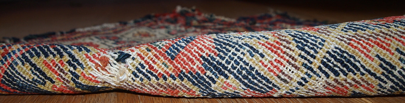 Hand made antique Malayer bag face in original condition with some age wear. The rug made has traditional tribal design in navy blue, white and red shades. 