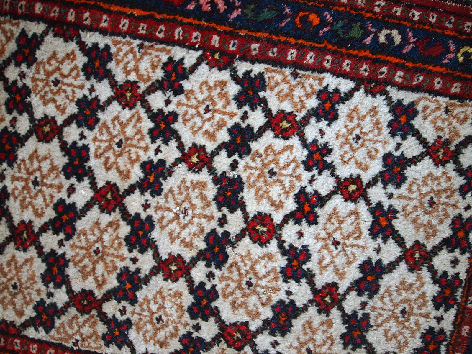 Antique Hamadan runner in good original condition. The rug is in white, red and blue shades.