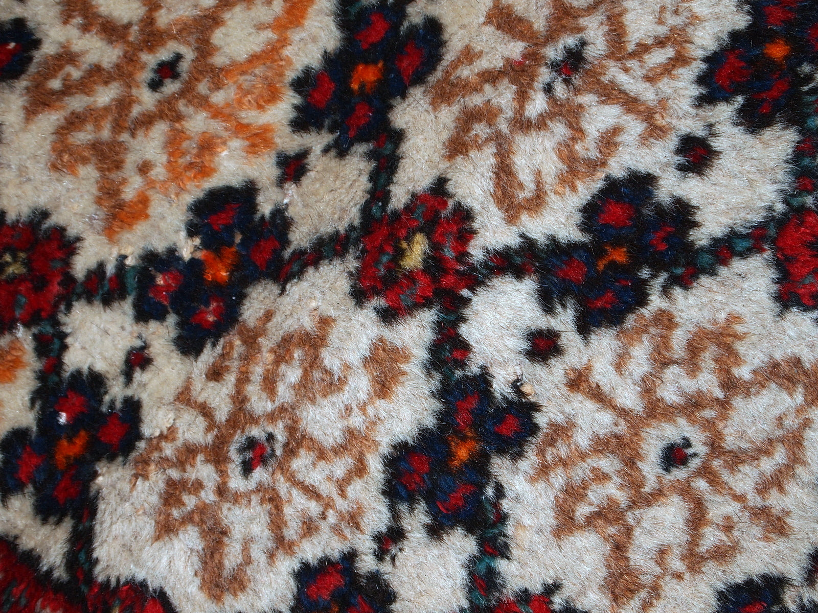Antique Hamadan runner in good original condition. The rug is in white, red and blue shades.