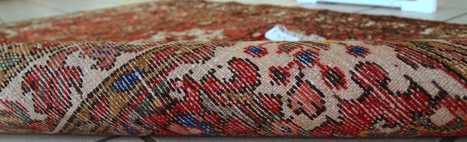 Vintage Persian Hamadan rug in good original condition. The rug is from the middle of 20th century made in red wool.