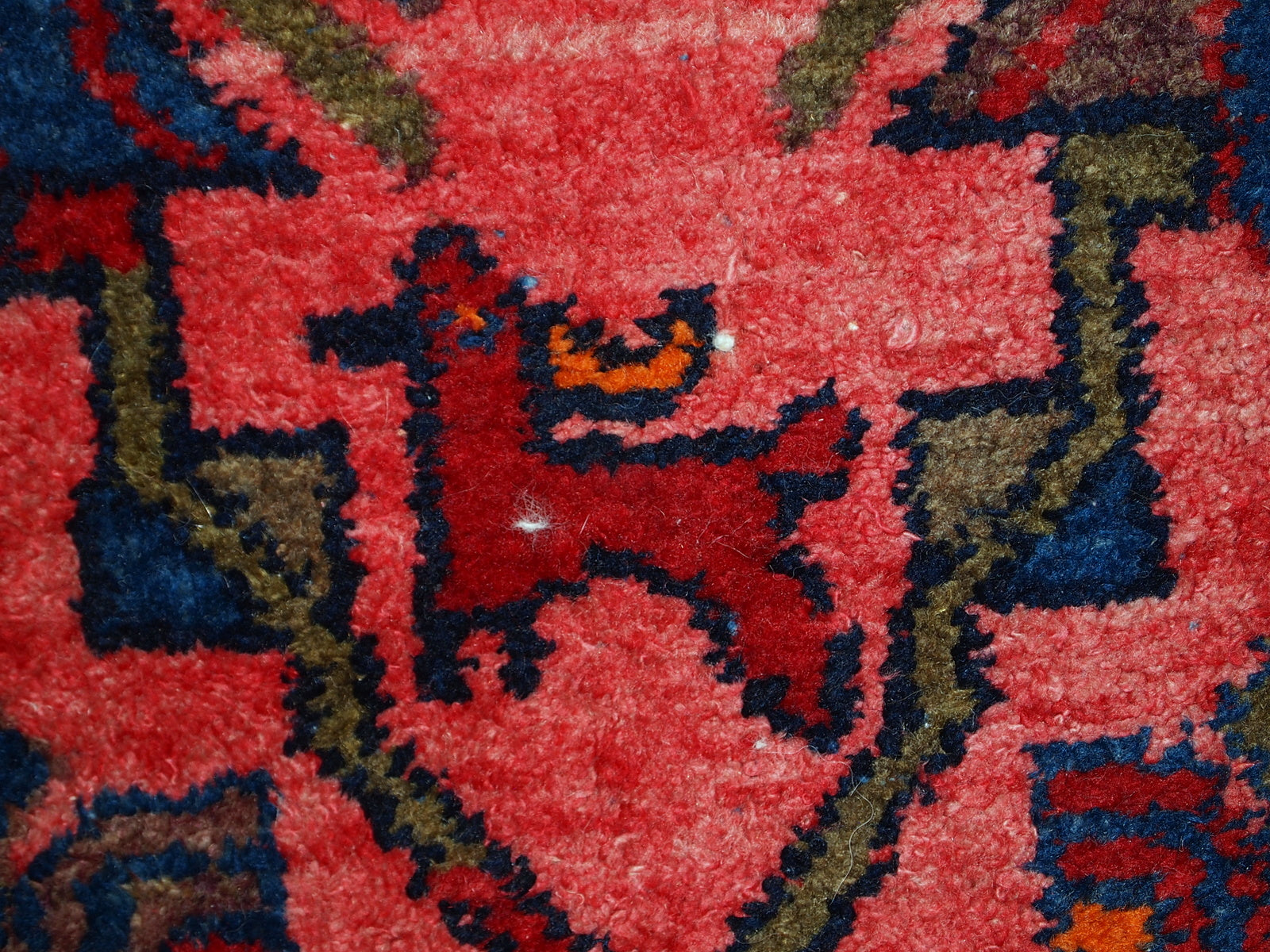 Hand made antique Persian Malayer rug in original good condition. The main colors of this rug are variety of red shades. The details of the tribal ornaments on it are in navy blue and olive shades. 