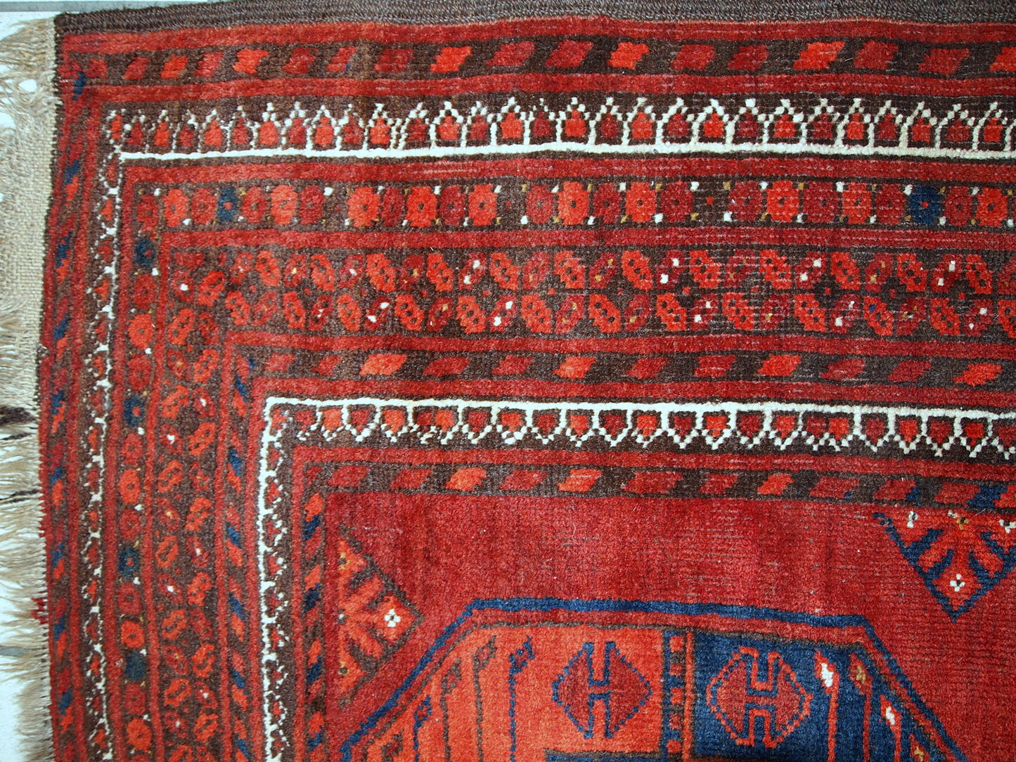 Antique Afghan Ersari rug in original condition, it has some low pile. The rug is from the mid 20th century made in red wool.