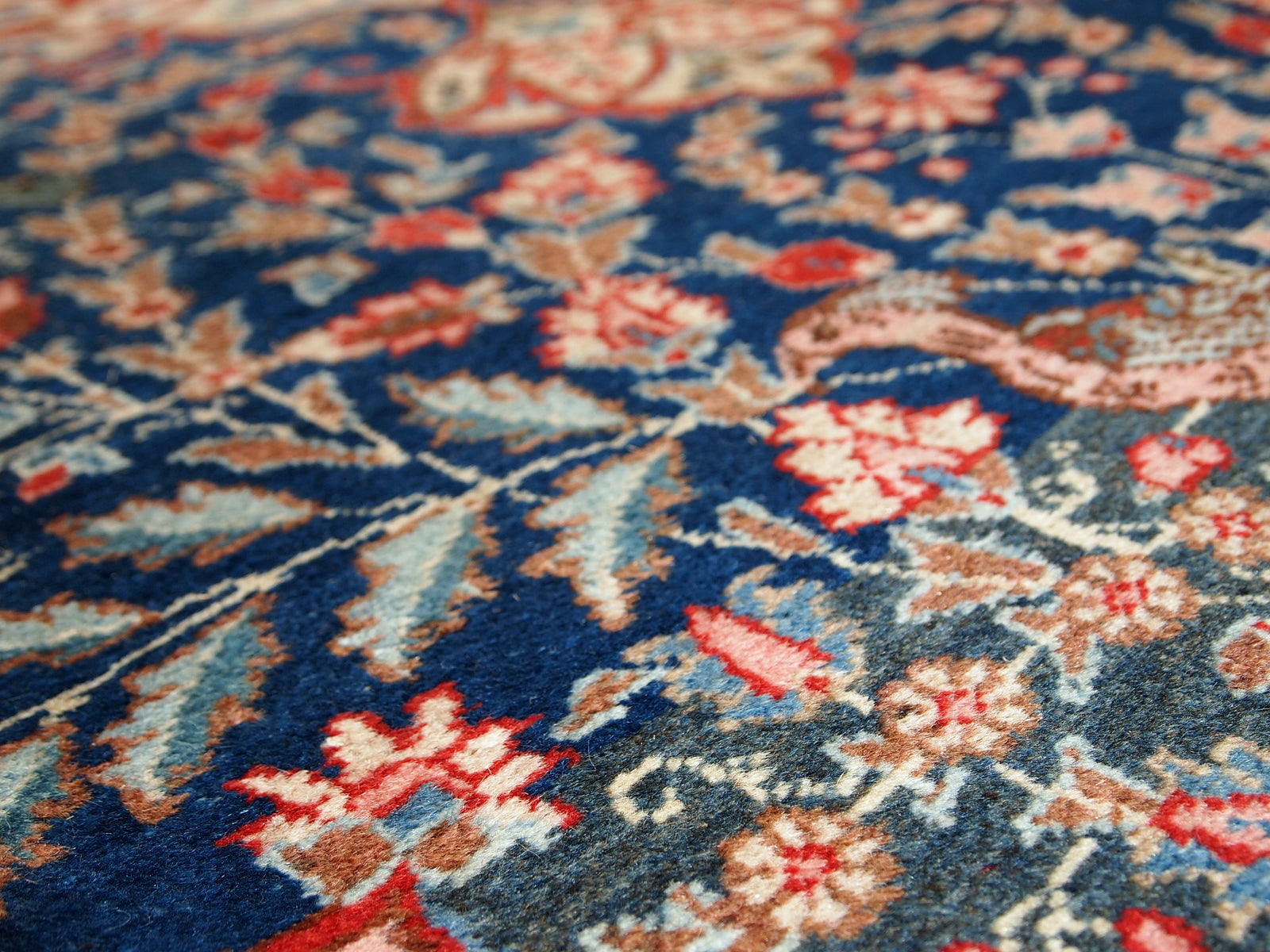 Antique Tabriz rug in original good condition. This beautiful masterpiece made in the beginning of 20th century in navy blue and pink shades.