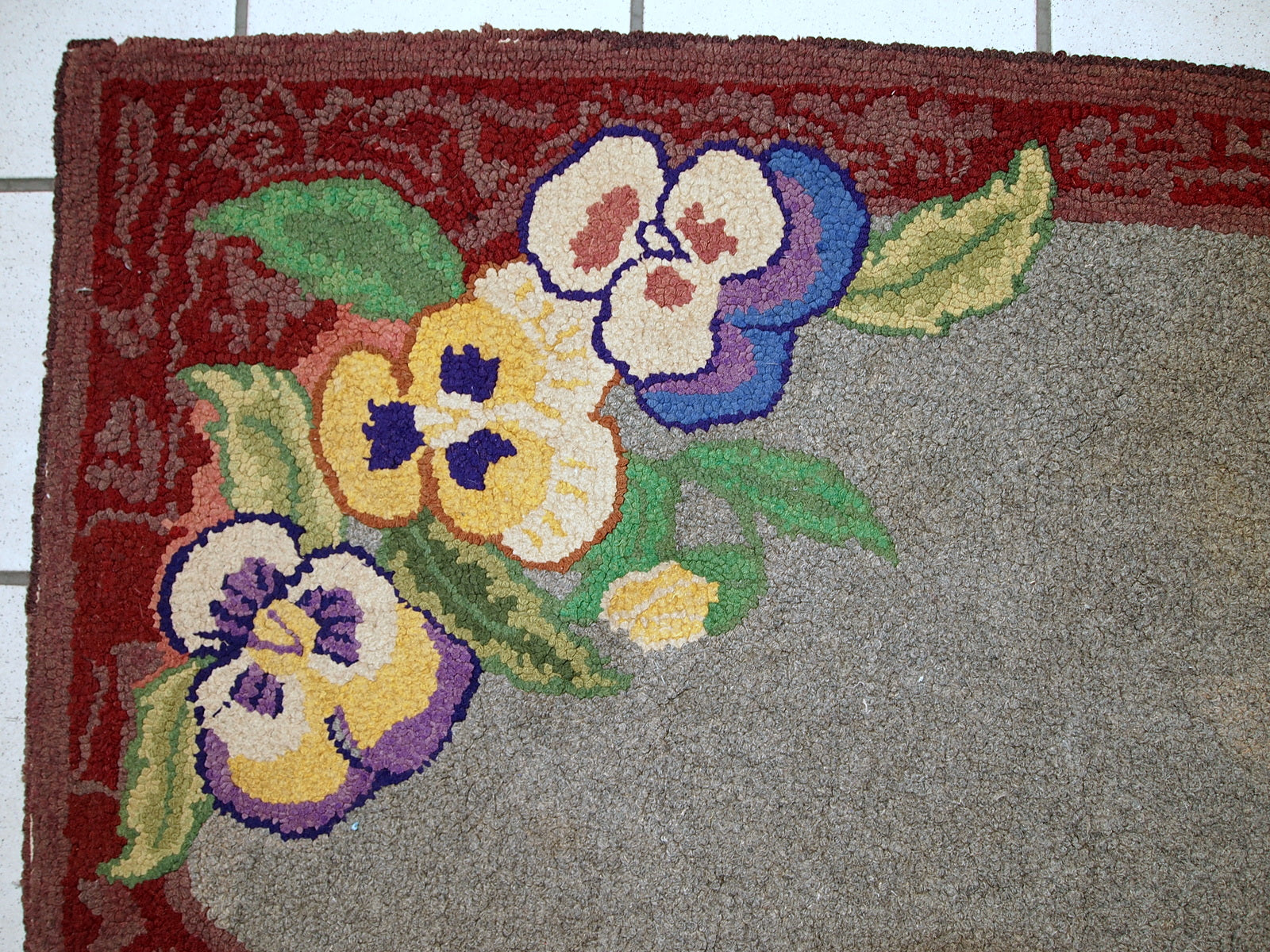 Antique decorative American hooked rug with allover design in grey shade. The condition is original good.