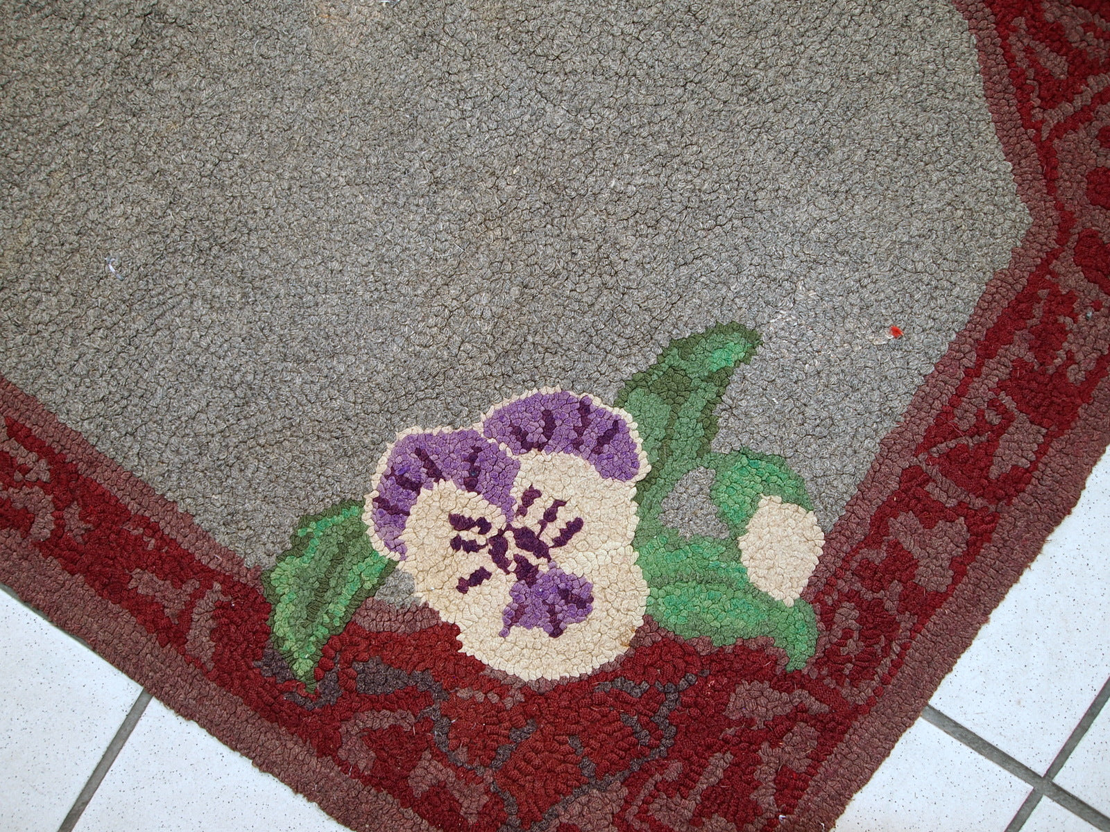 Antique decorative American hooked rug with allover design in grey shade. The condition is original good.