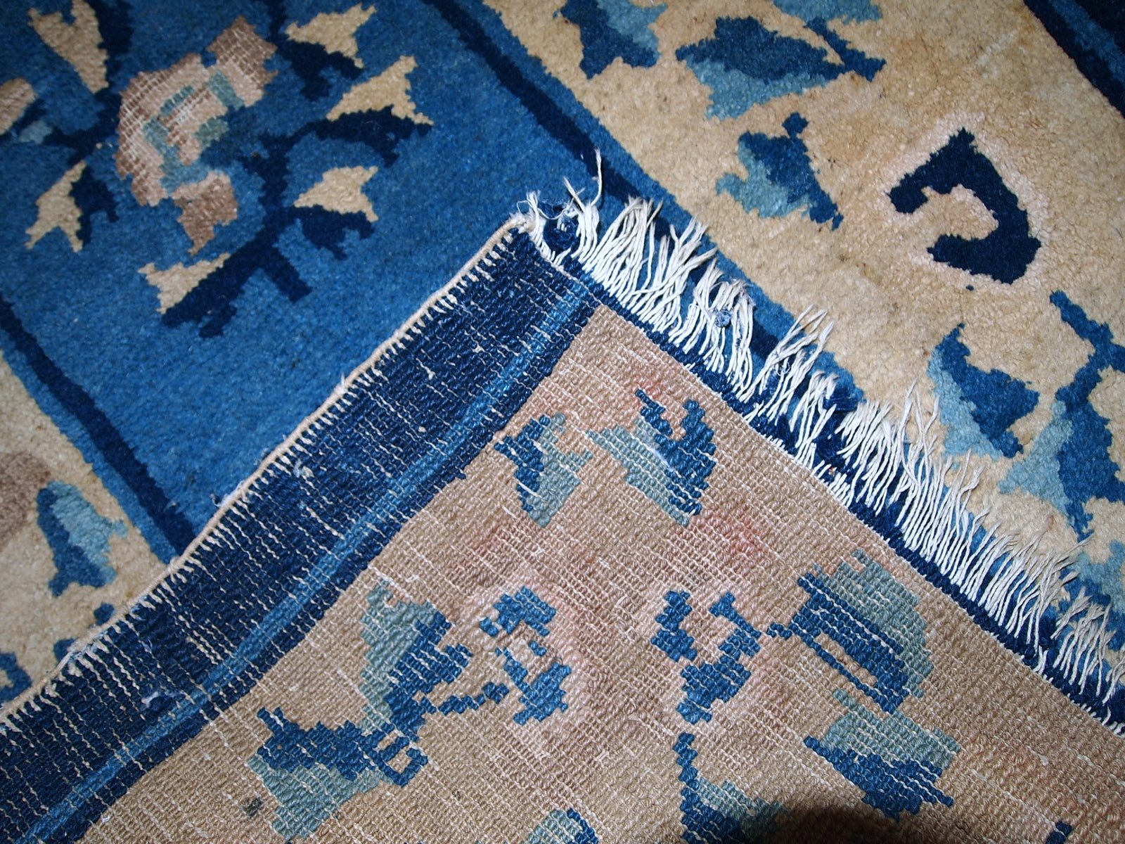 Reverse side of the antique Peking Chinese rug, showcasing craftsmanship and texture.