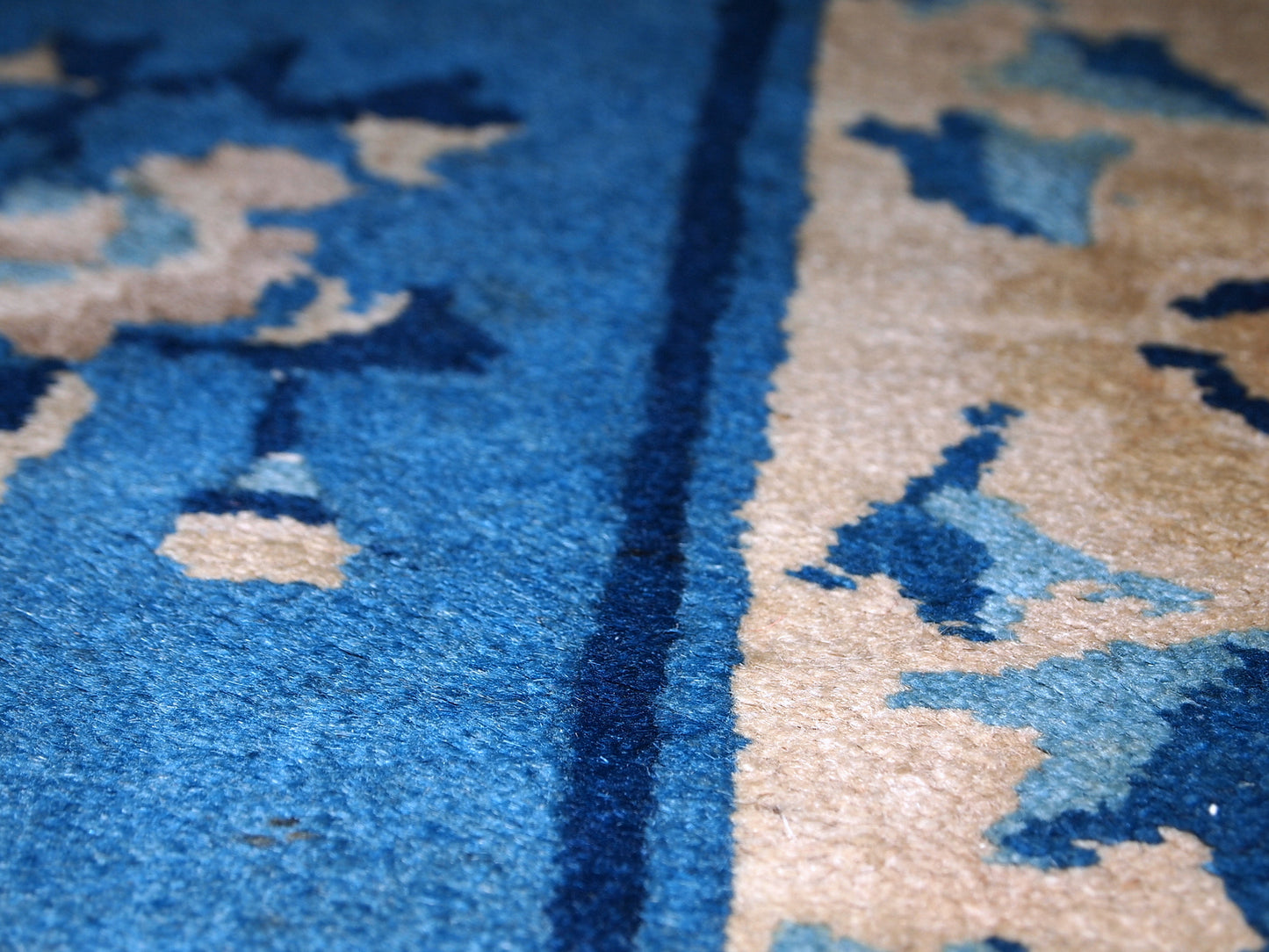 Detailed view of the antique rug's cultural history.