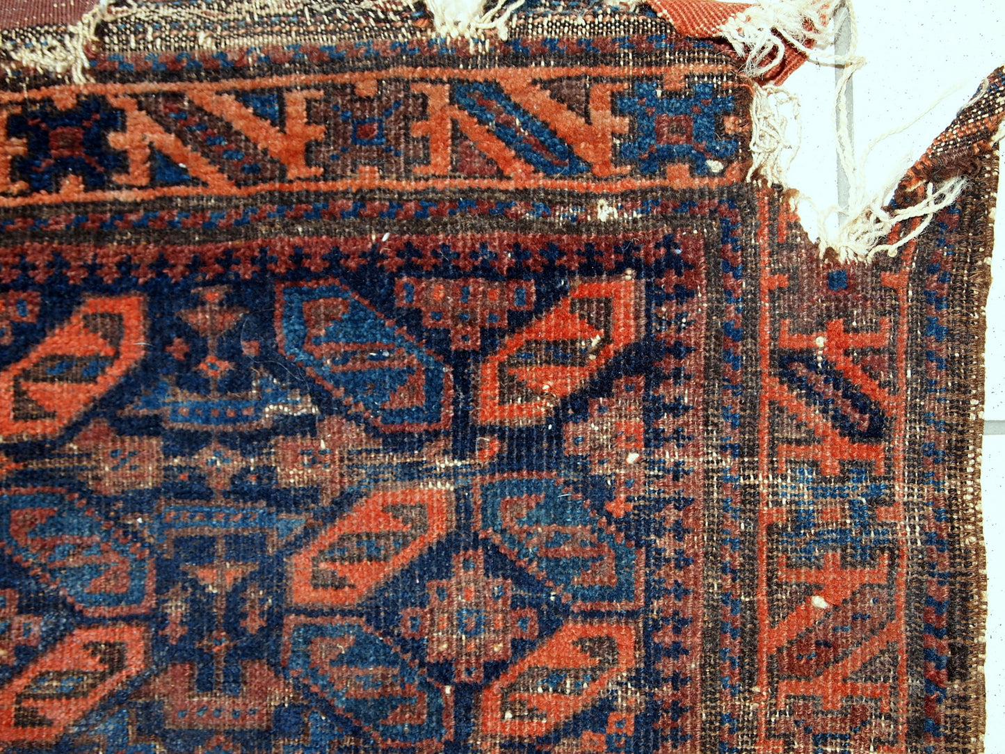 Collectible Afghan Baluch bagface in distressed condition. The rug has been made in the end of 19th century in Afghanistan.