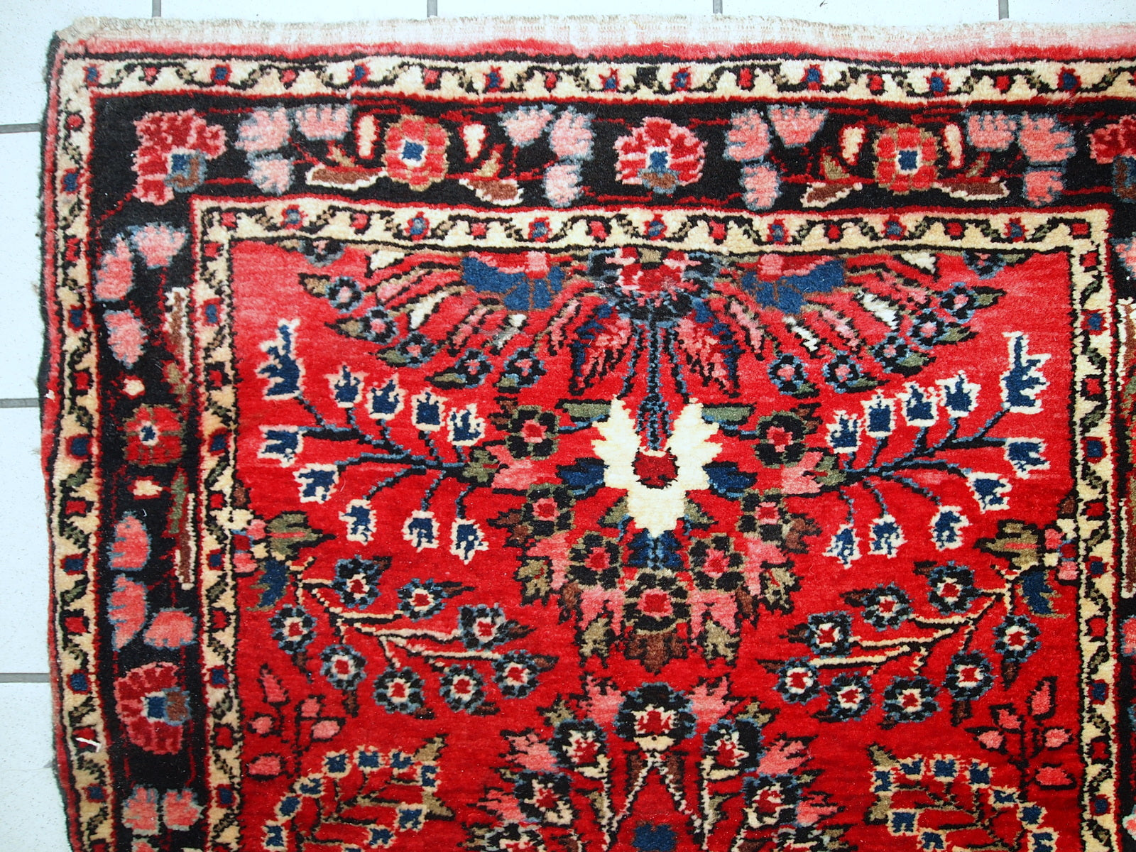 Hand made antique Persian Lilihan runner in original condition, it has several areas with low pile. This runner is heavy, it has been made in the beginning of 20th century.