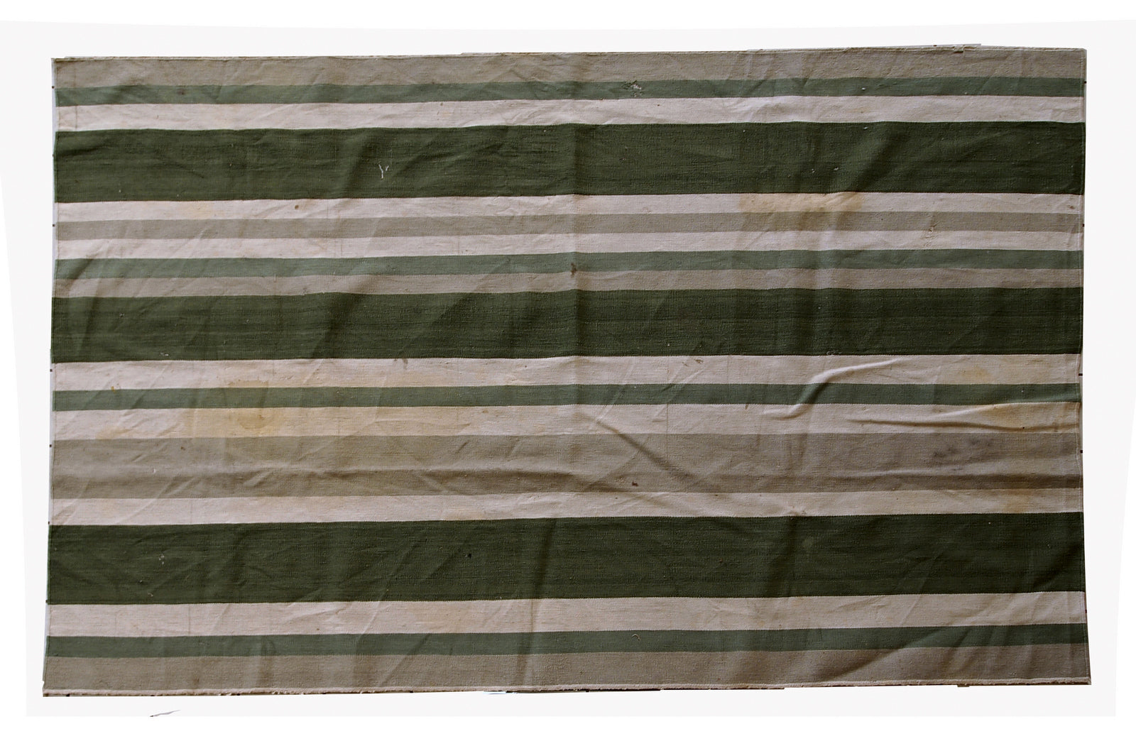 This kilim has very simple stripes motive in dark green, white and grey shades. It is in original condition from the beginning of 20th century, has some stains.
