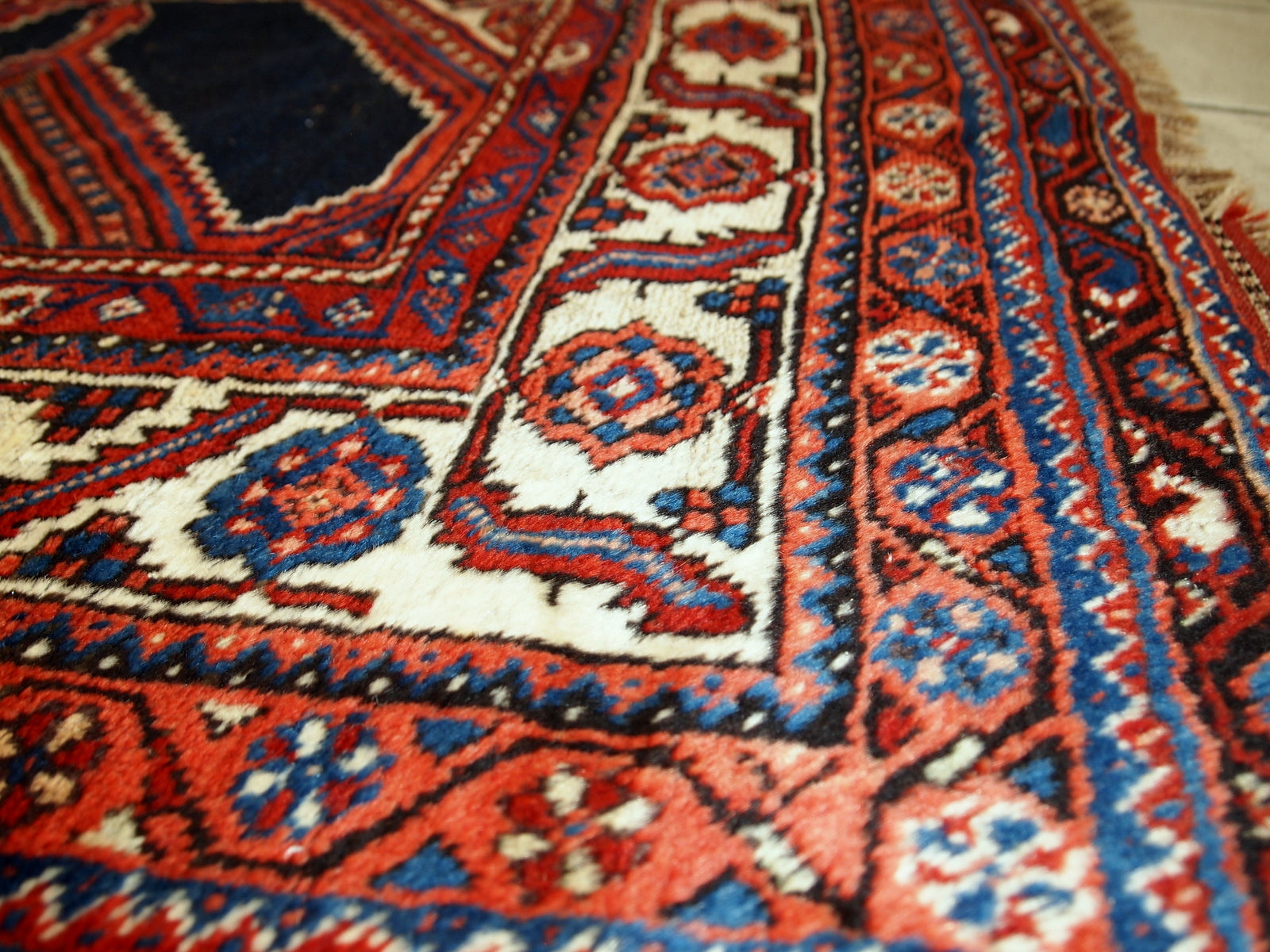 Handmade antique distressed Persian Shiraz rug, 1900s