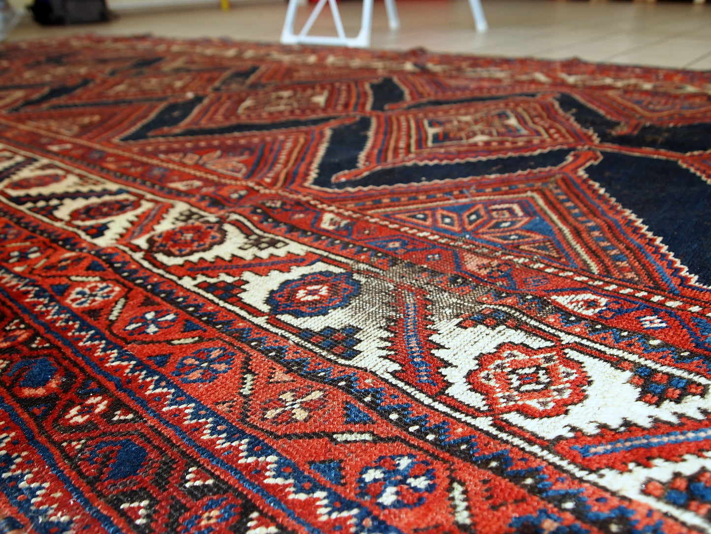 Handmade antique distressed Persian Shiraz rug, 1900s