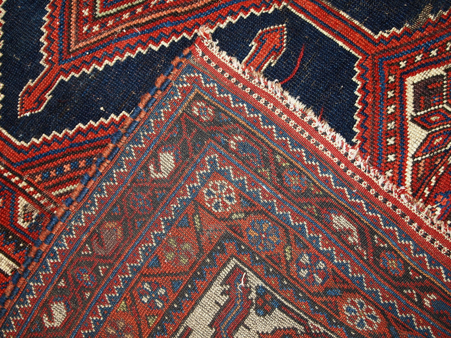 Handmade antique distressed Persian Shiraz rug, 1900s