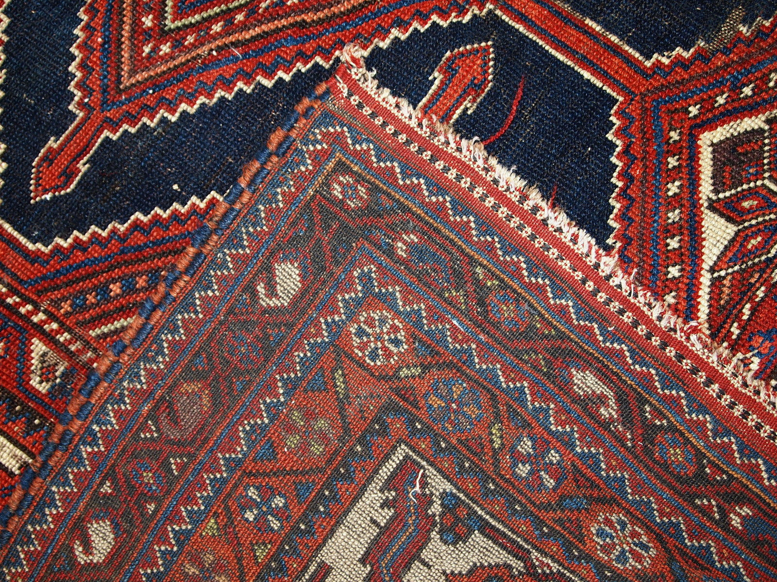 Handmade antique distressed Persian Shiraz rug, 1900s