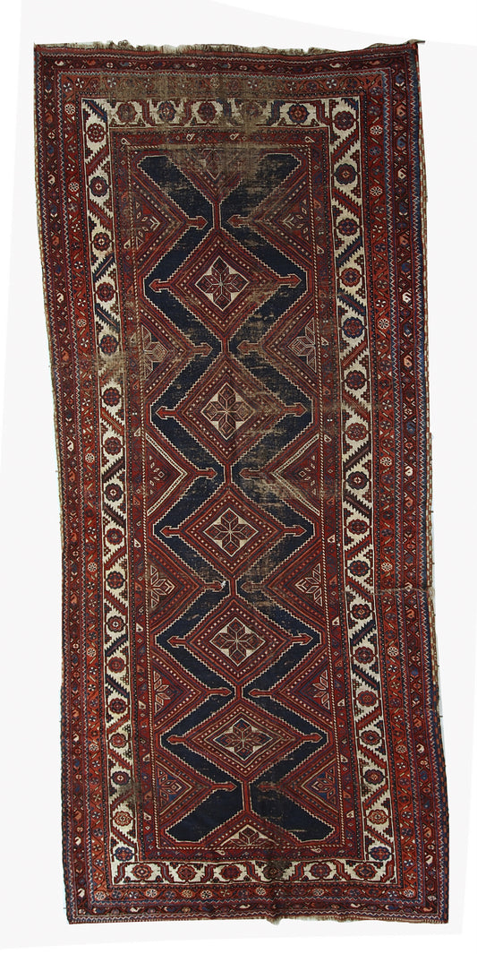 Handmade antique distressed Persian Shiraz rug, 1900s