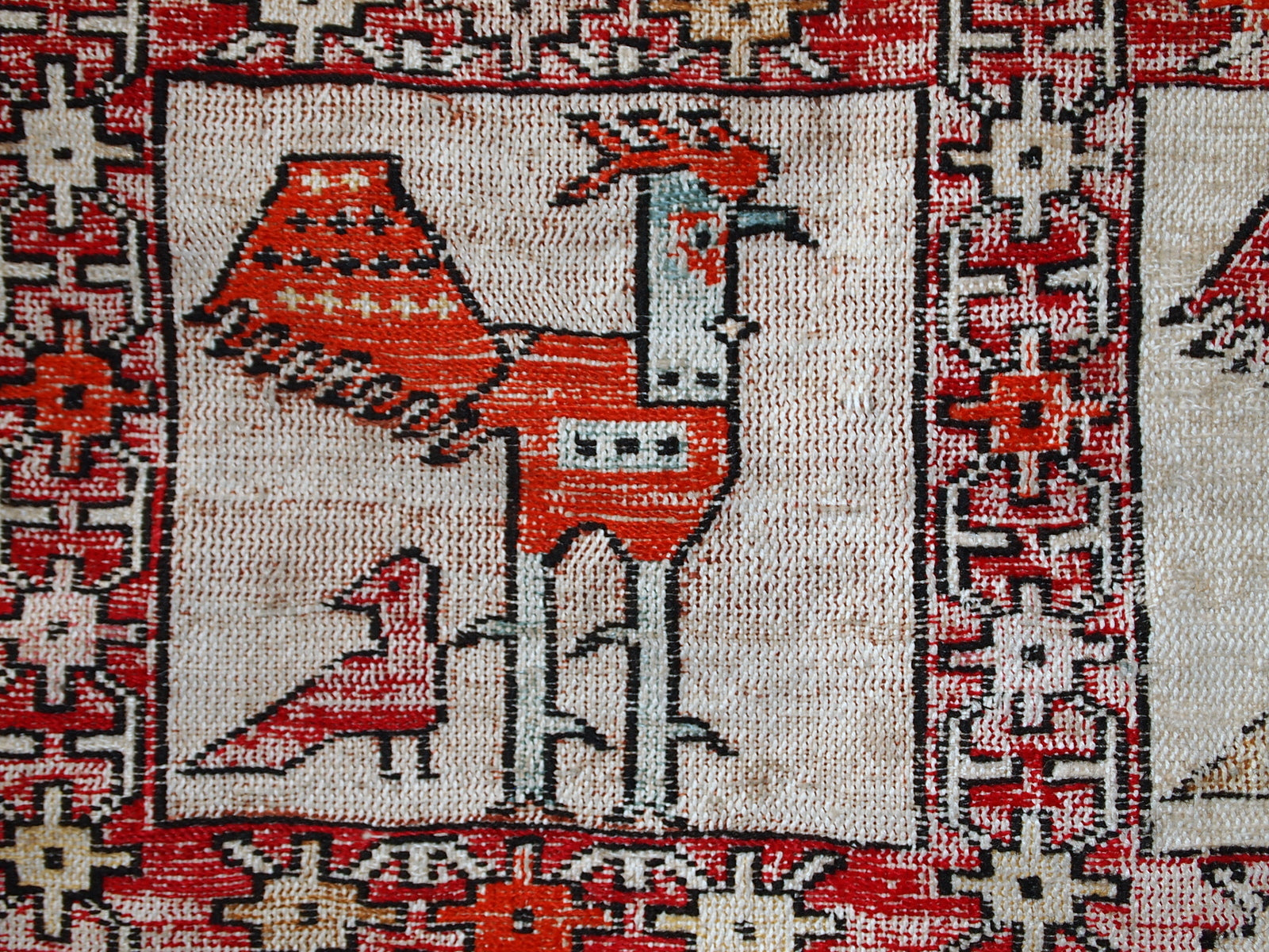 Vintage Persian flat-weave in original good condition. This kilim was made out of artificial silk on cotton base. It has very unusual design of repeated roosters in different shades. It has been made with an accent of warn effect, but it is actually in original good condition.