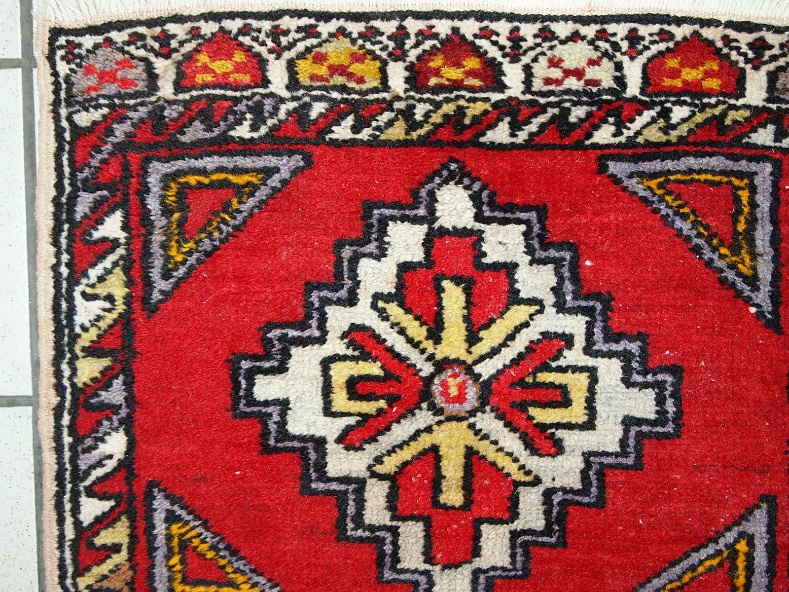 Vintage Turkish Yastik rug in original good condition. This rug made out of wool in bright red shade.