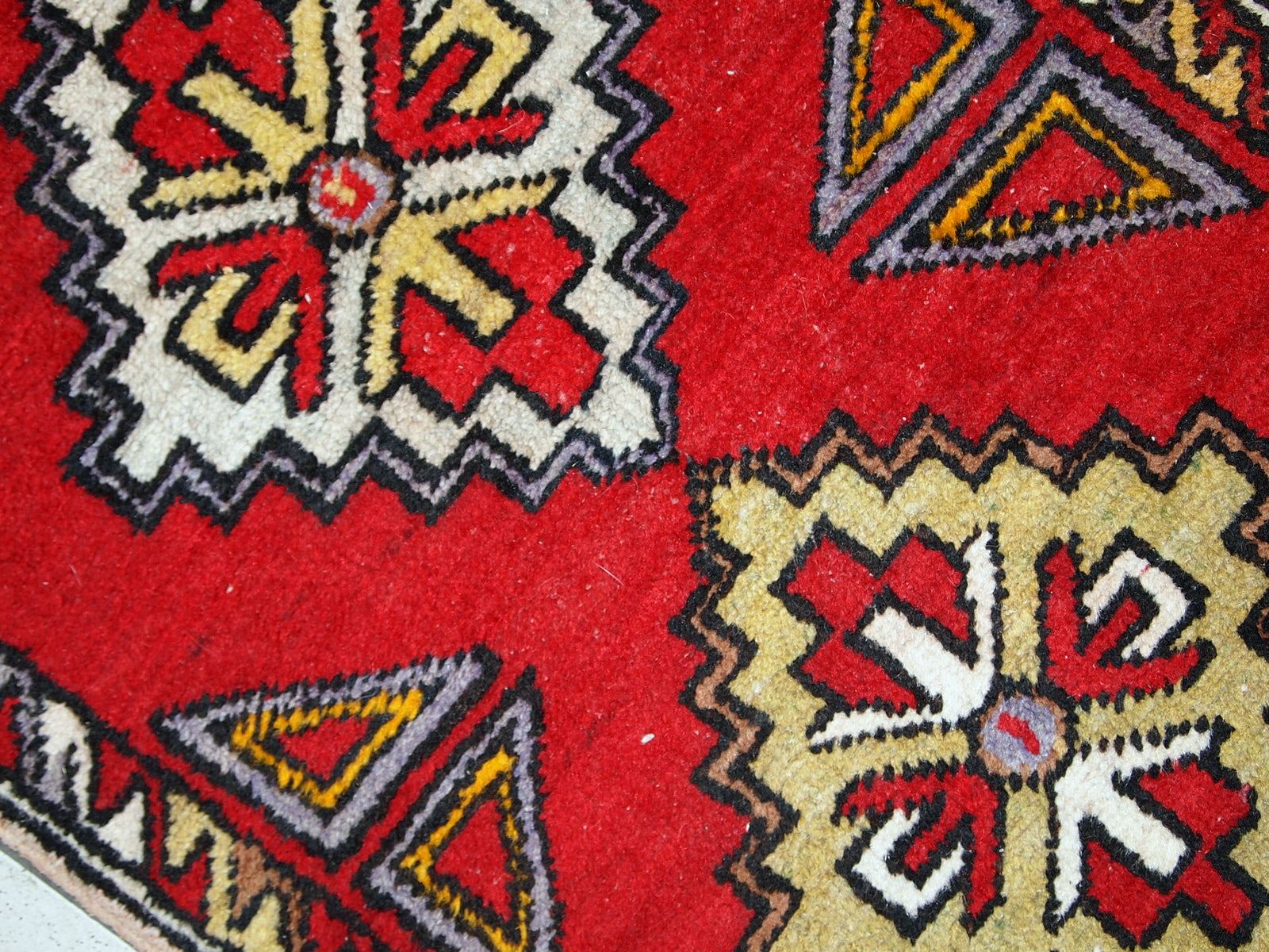 Vintage Turkish Yastik rug in original good condition. This rug made out of wool in bright red shade.