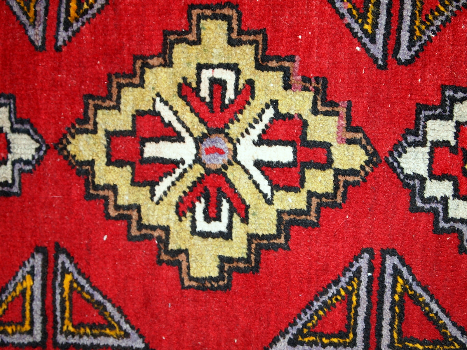 Vintage Turkish Yastik rug in original good condition. This rug made out of wool in bright red shade.