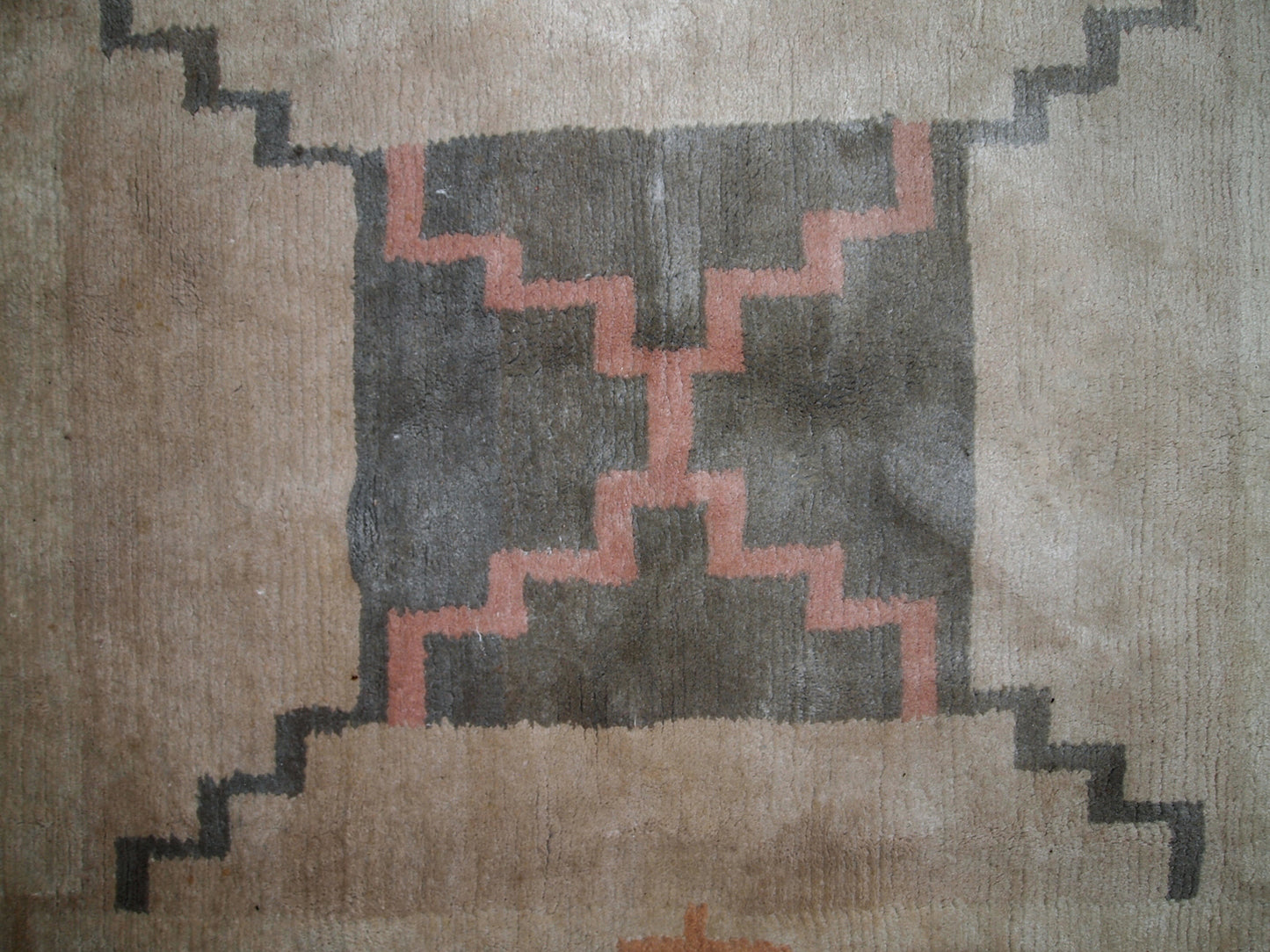 Handmade vintage Tibetan Khaden rug in original good condition. The rug has full pile, made in geometric design in beige shade. The rug is heavy.