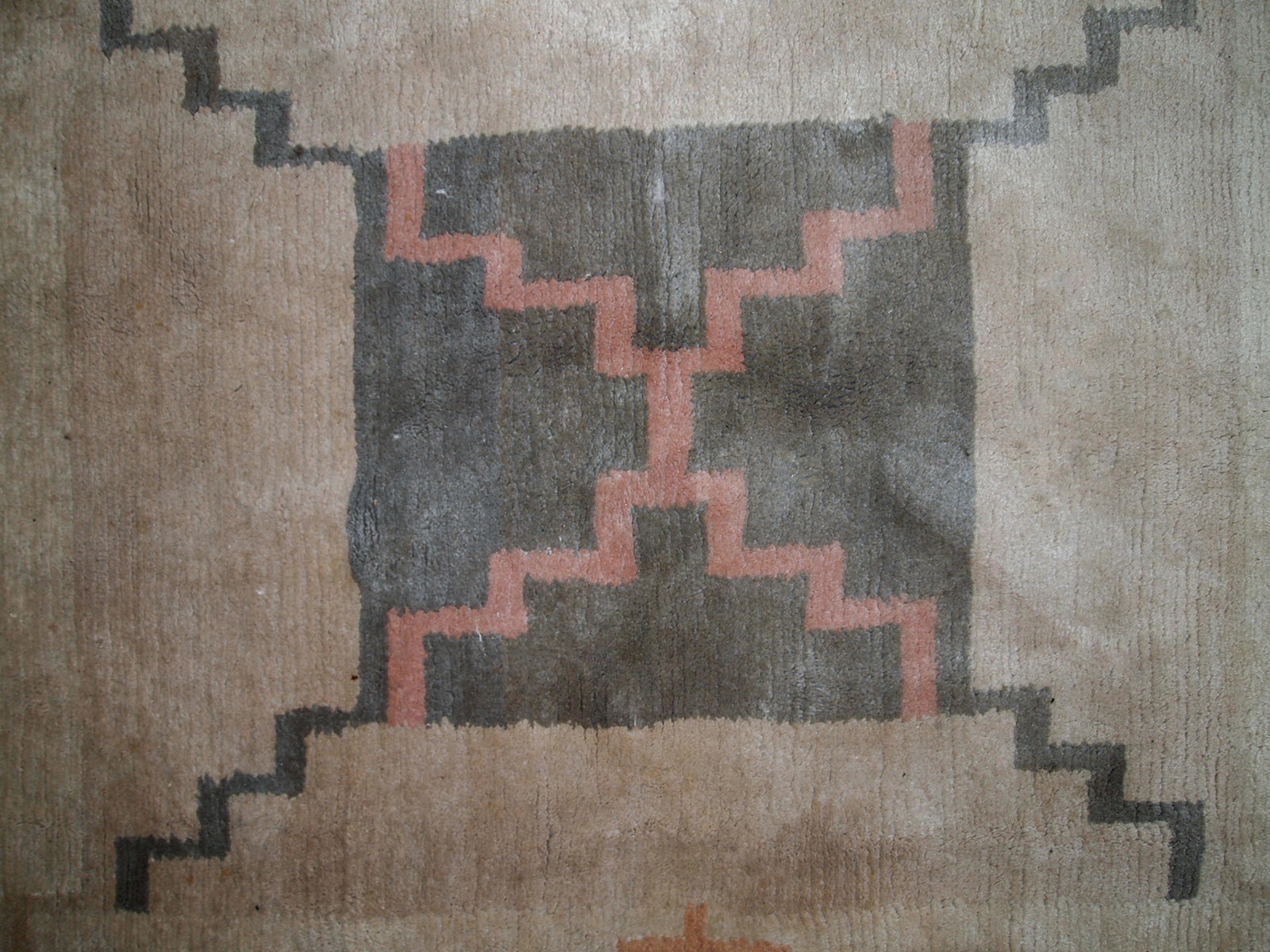 Handmade vintage Tibetan Khaden rug in original good condition. The rug has full pile, made in geometric design in beige shade. The rug is heavy.