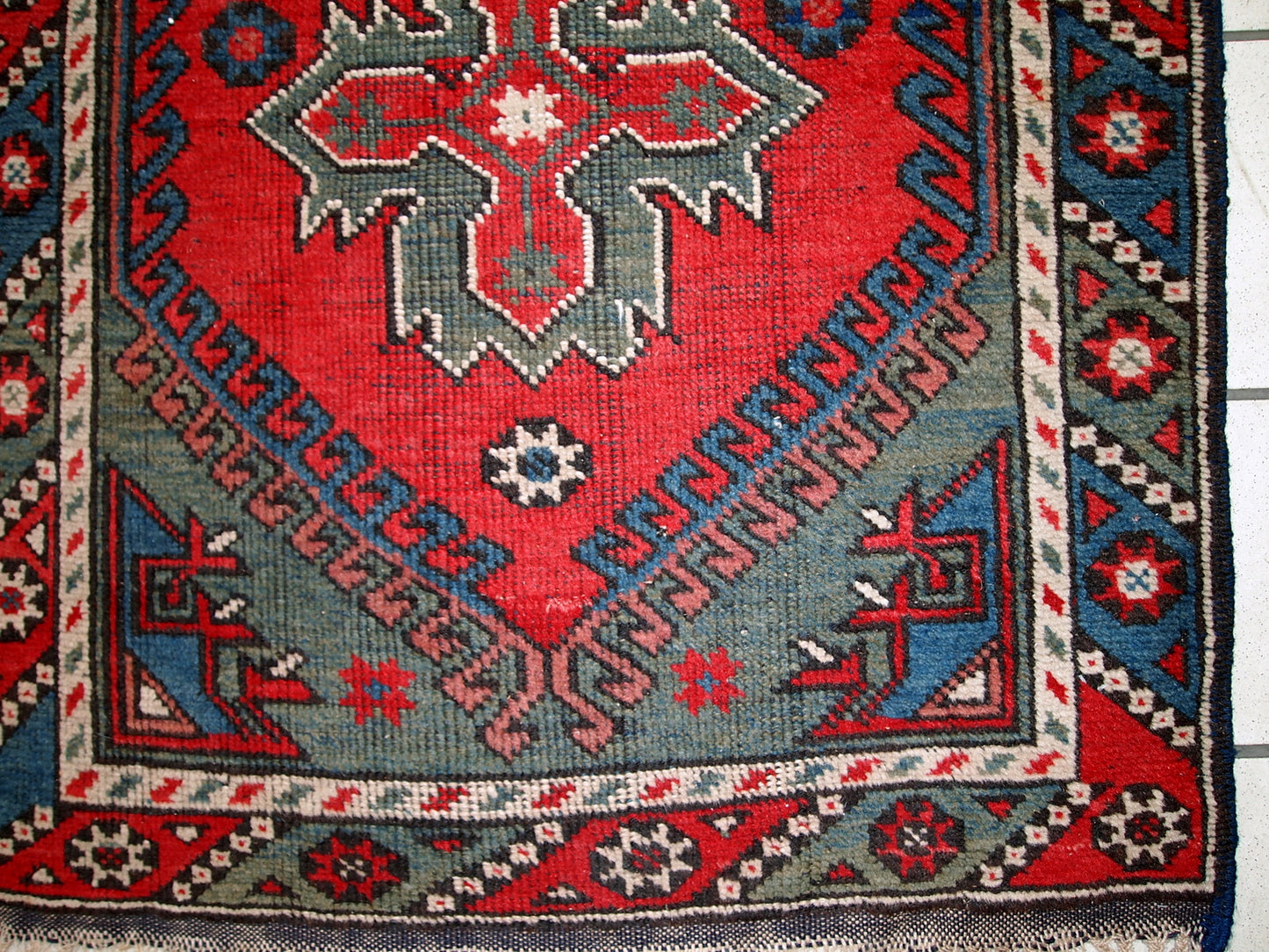 Turkish Anatolian antique handmade rug in bright red and green shades. The rug is in original good condition, it has some low pile. 
