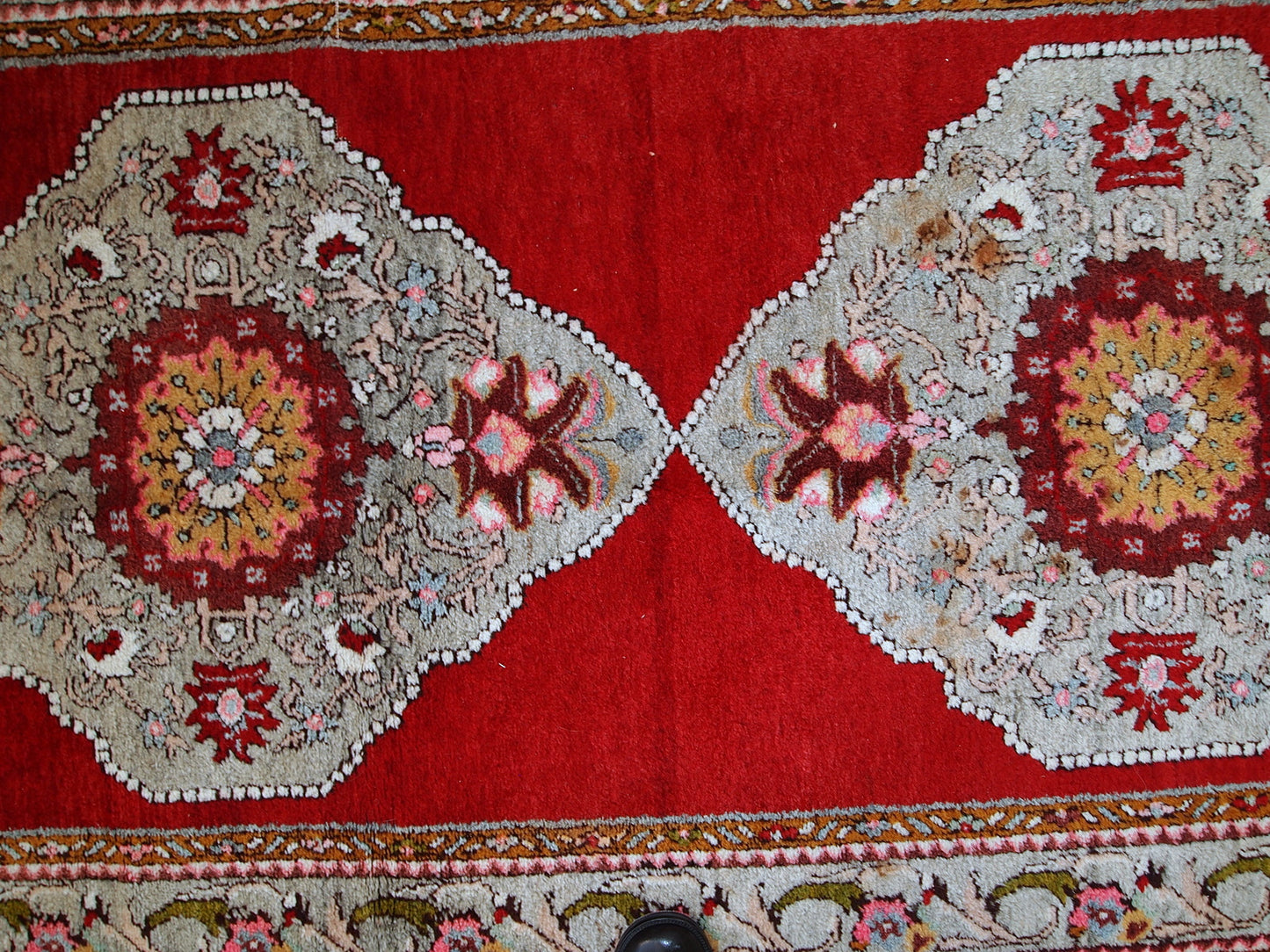 Vintage woolen Turkish Oushak runner in original good condition. It is in bright red shades with sky blue medallions. The wool is very soft.