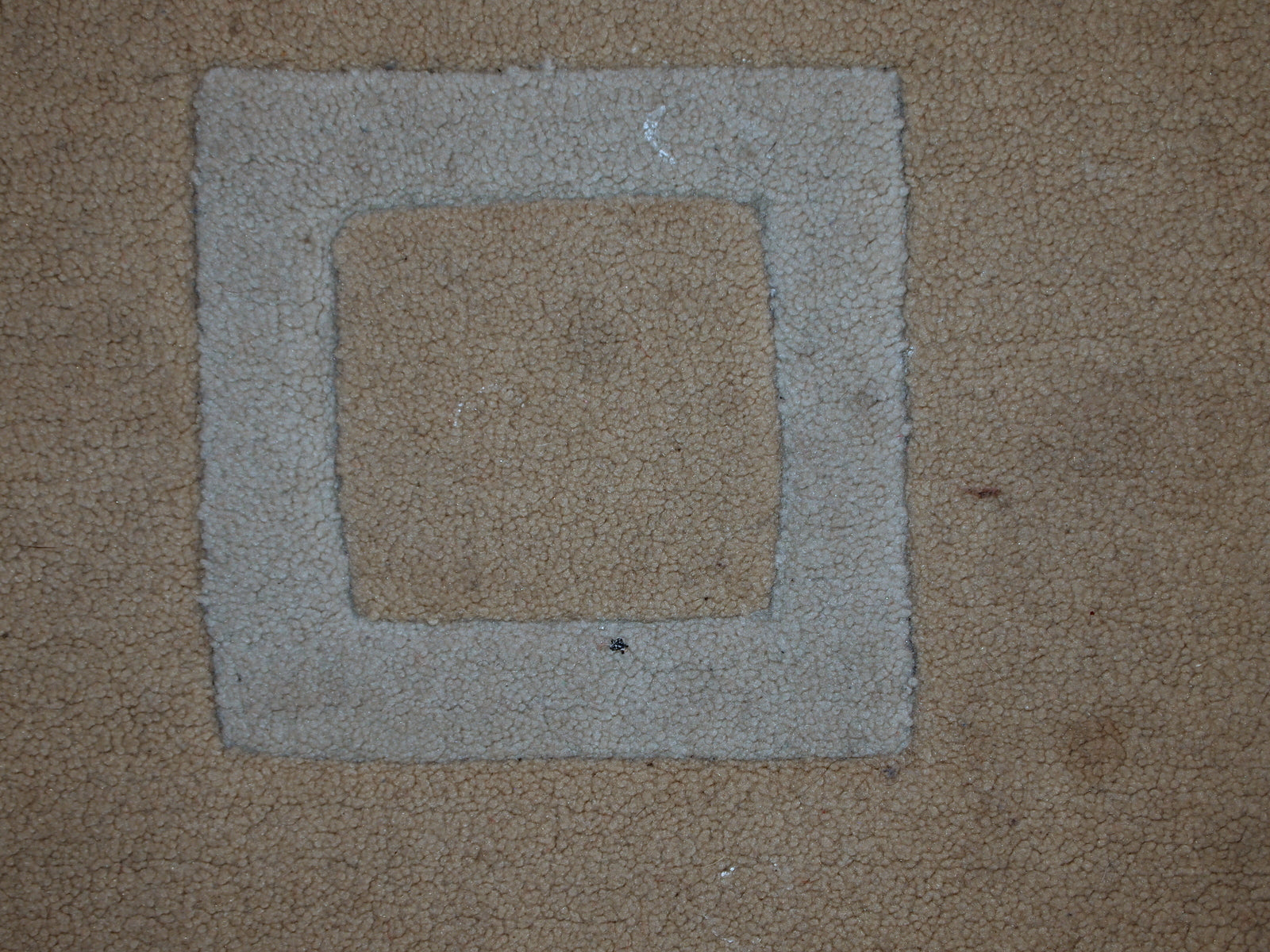 Handmade Chinese rug in light shades of white and brown. It has modern geometric design. The rug made out of acrylic in China. It is in original condition, has some age discolorations.