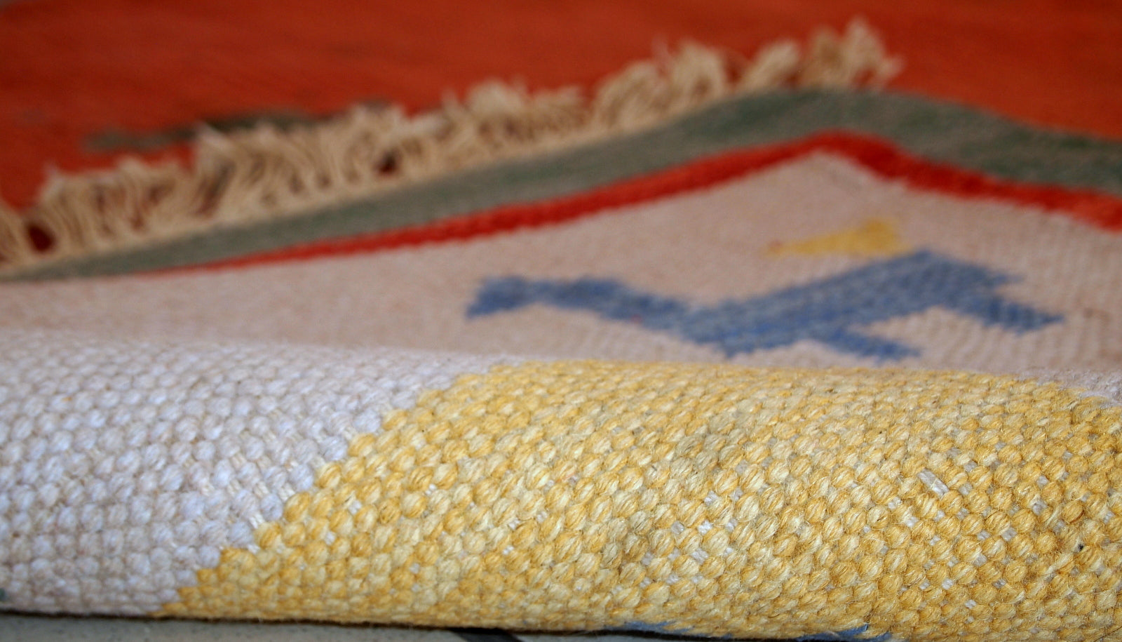 Vintage Persian kilim in bright shades of red, sky blue, beige and yellow. One side of the kilim has some age wear, but generally it is in original good condition.